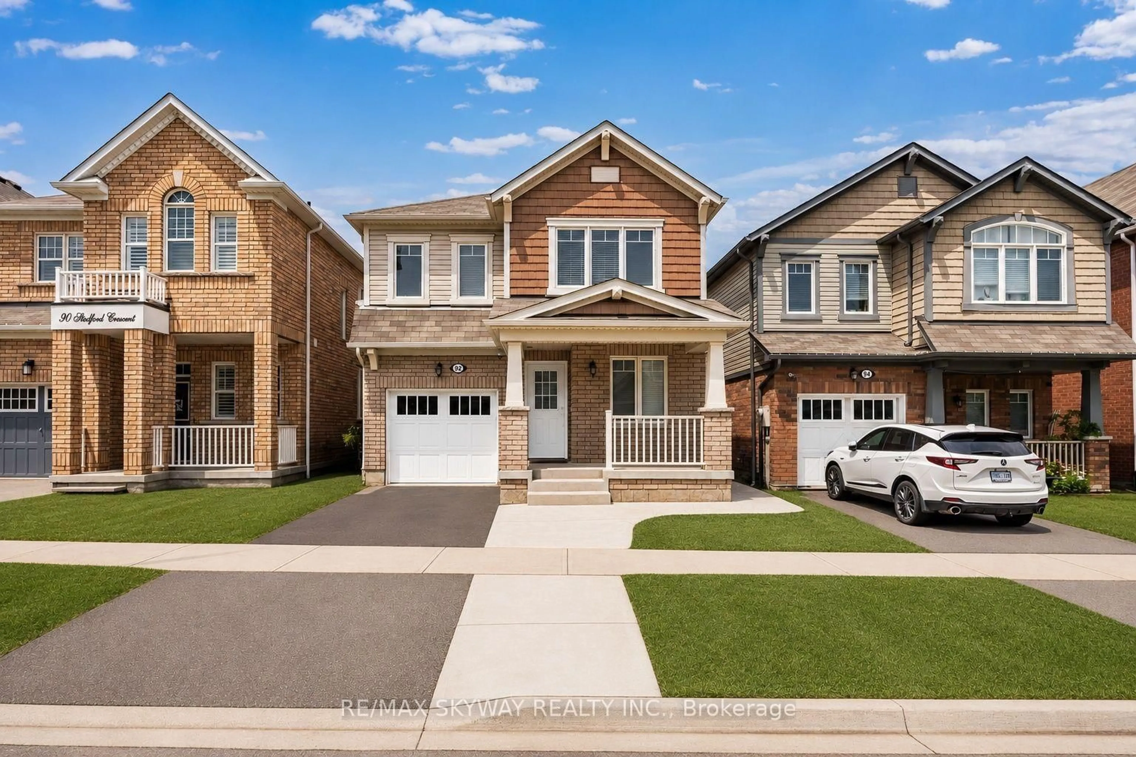 Home with brick exterior material, street for 92 Stedford Cres, Brampton Ontario L7A 4P7
