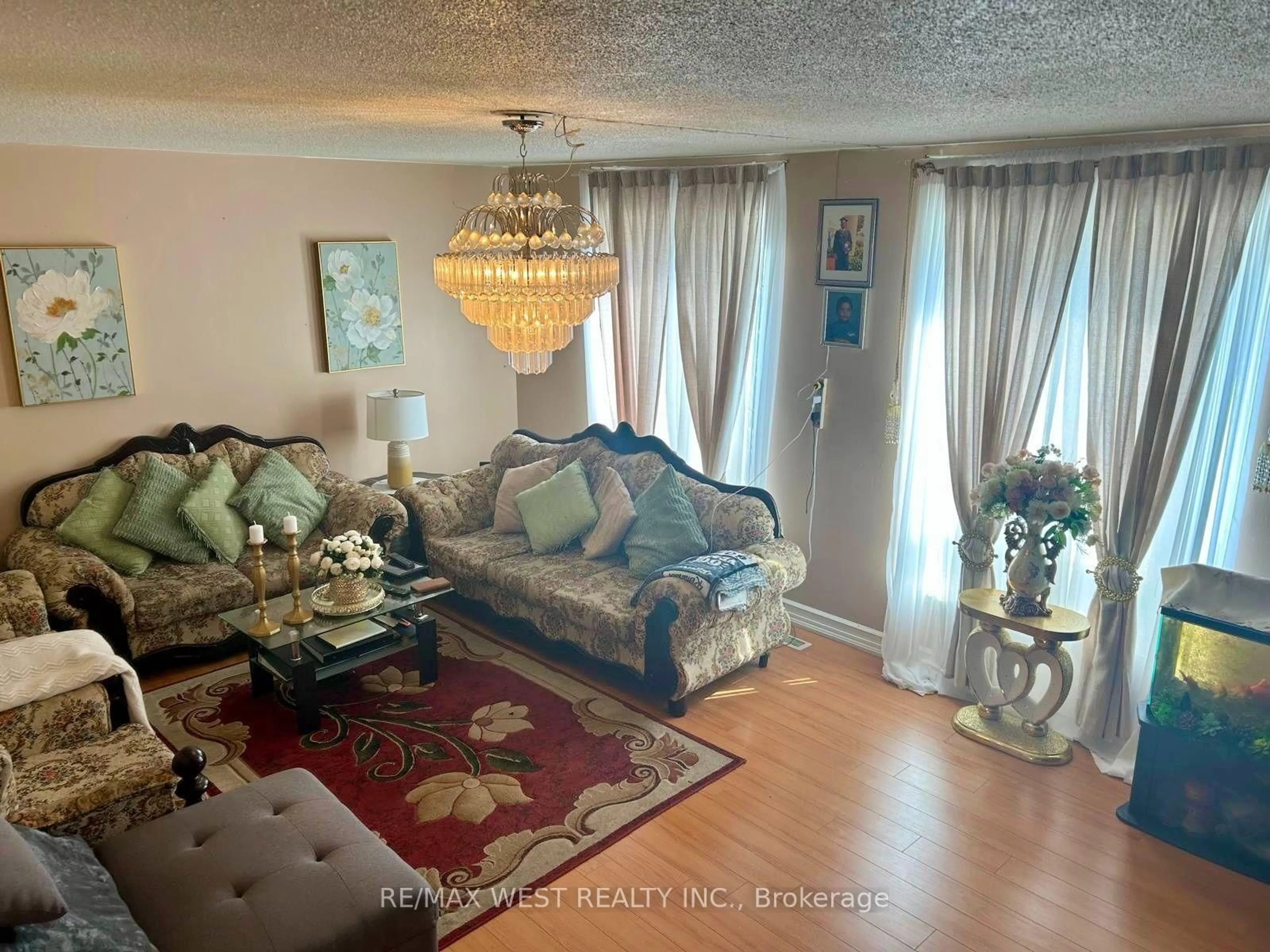Living room with furniture, unknown for 6458 Finch Ave #134, Toronto Ontario M9V 1T4
