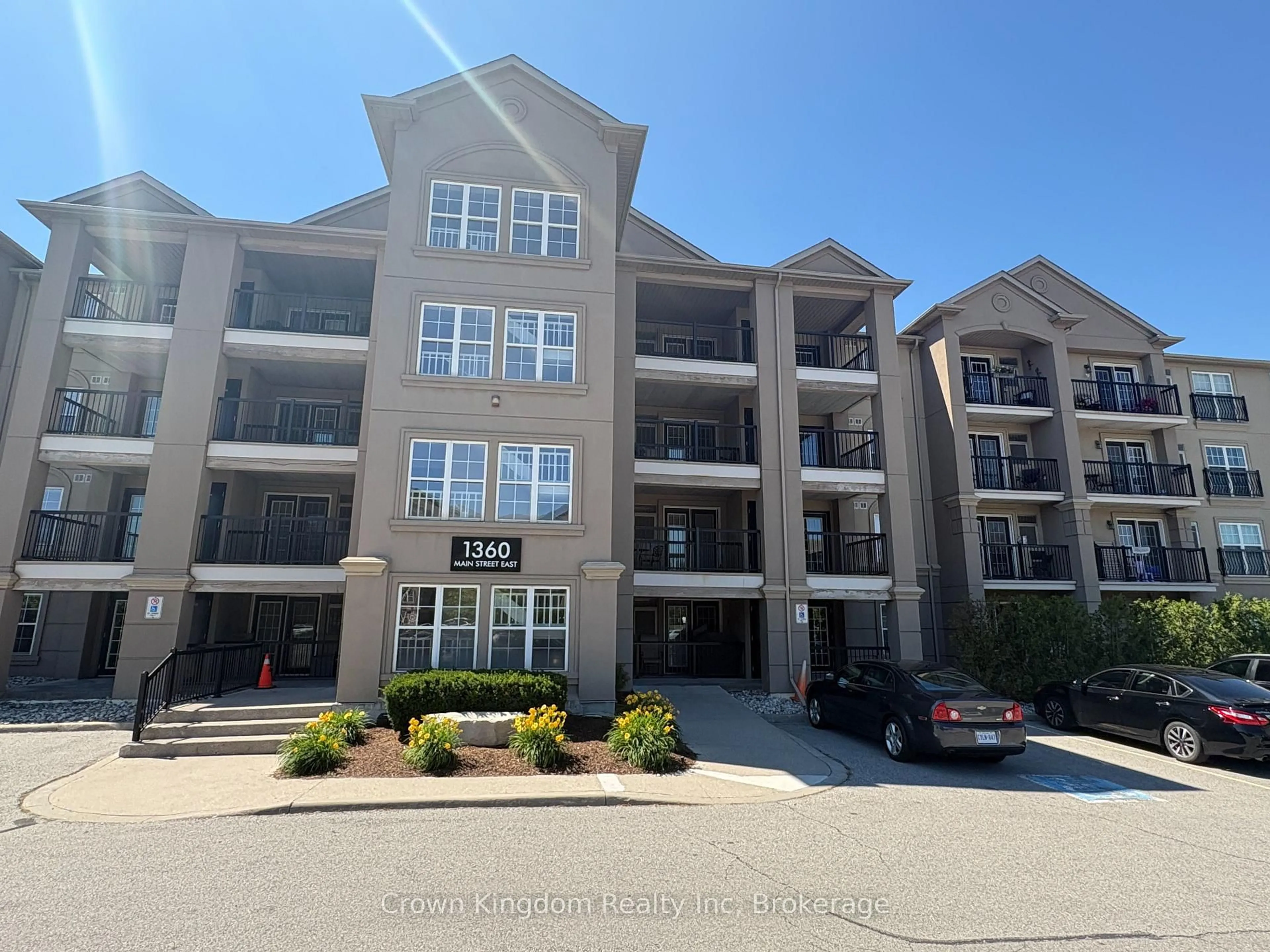 A pic from outside/outdoor area/front of a property/back of a property/a pic from drone, unknown for 1360 Main St #212, Milton Ontario L9T 7S5