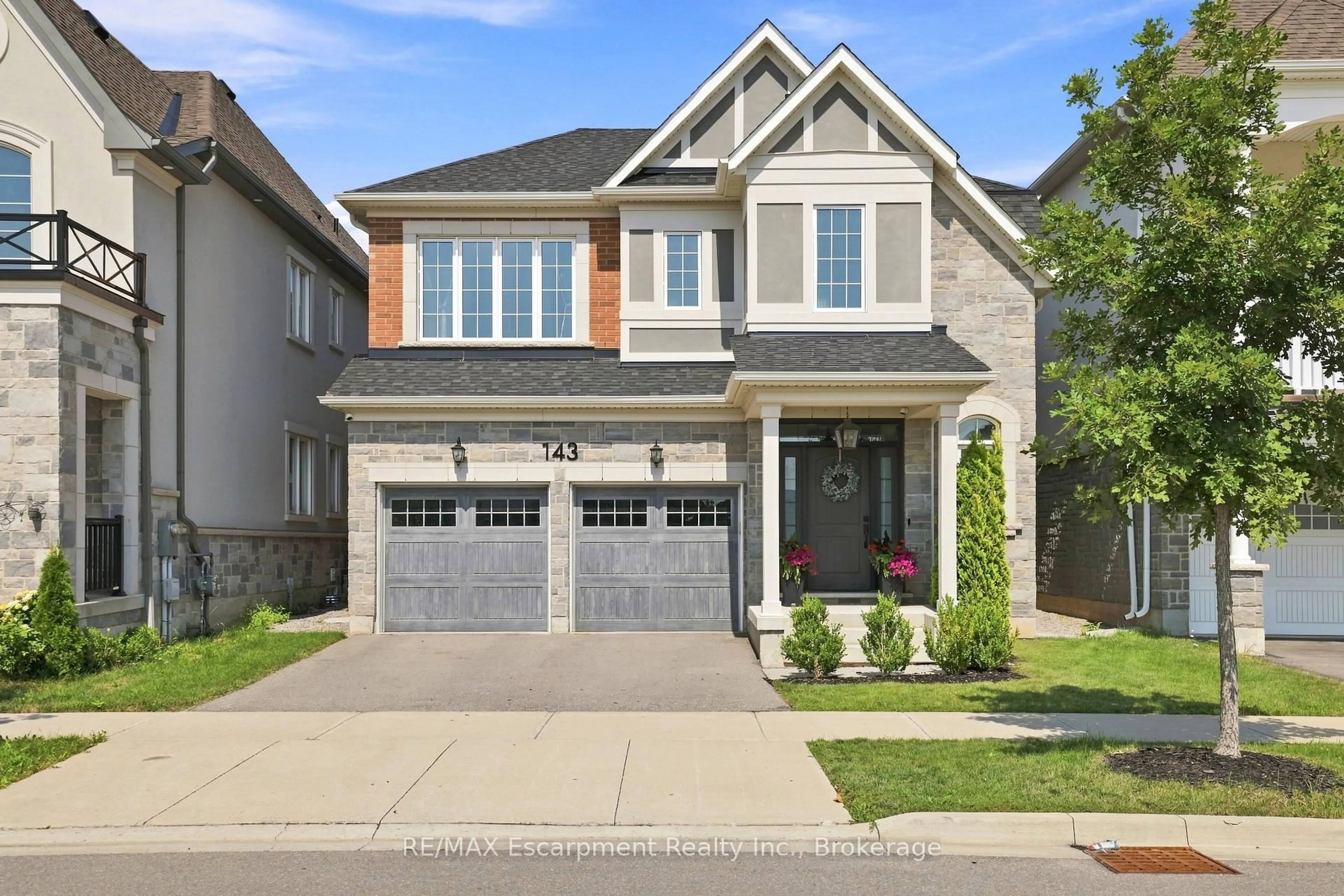 Home with brick exterior material, street for 143 Threshing Mill Blvd, Oakville Ontario L6H 0V5