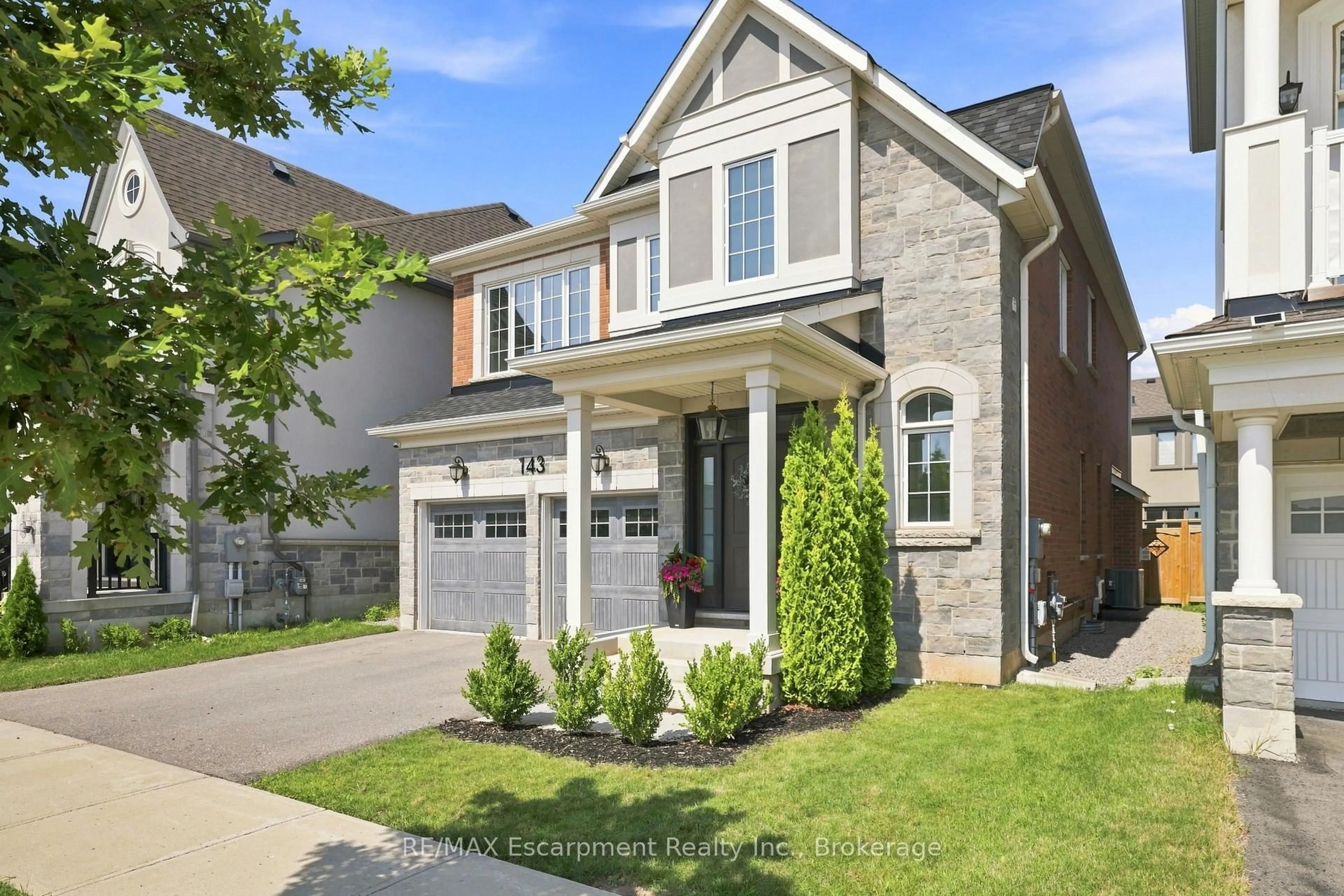 Home with brick exterior material, street for 143 Threshing Mill Blvd, Oakville Ontario L6H 0V5