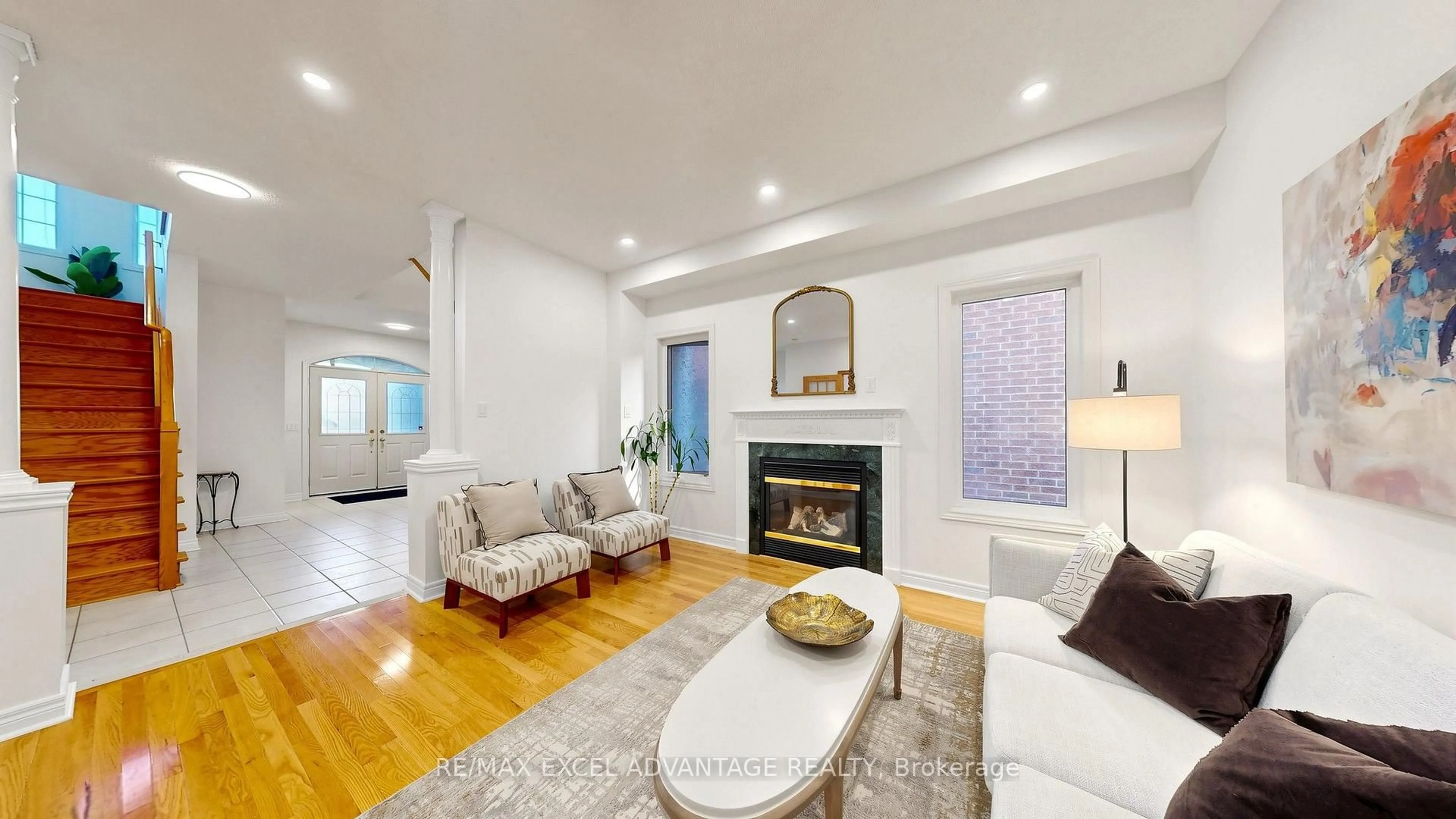 Living room with furniture, wood/laminate floor for 7238 Lowville Hts, Mississauga Ontario L5N 8L3