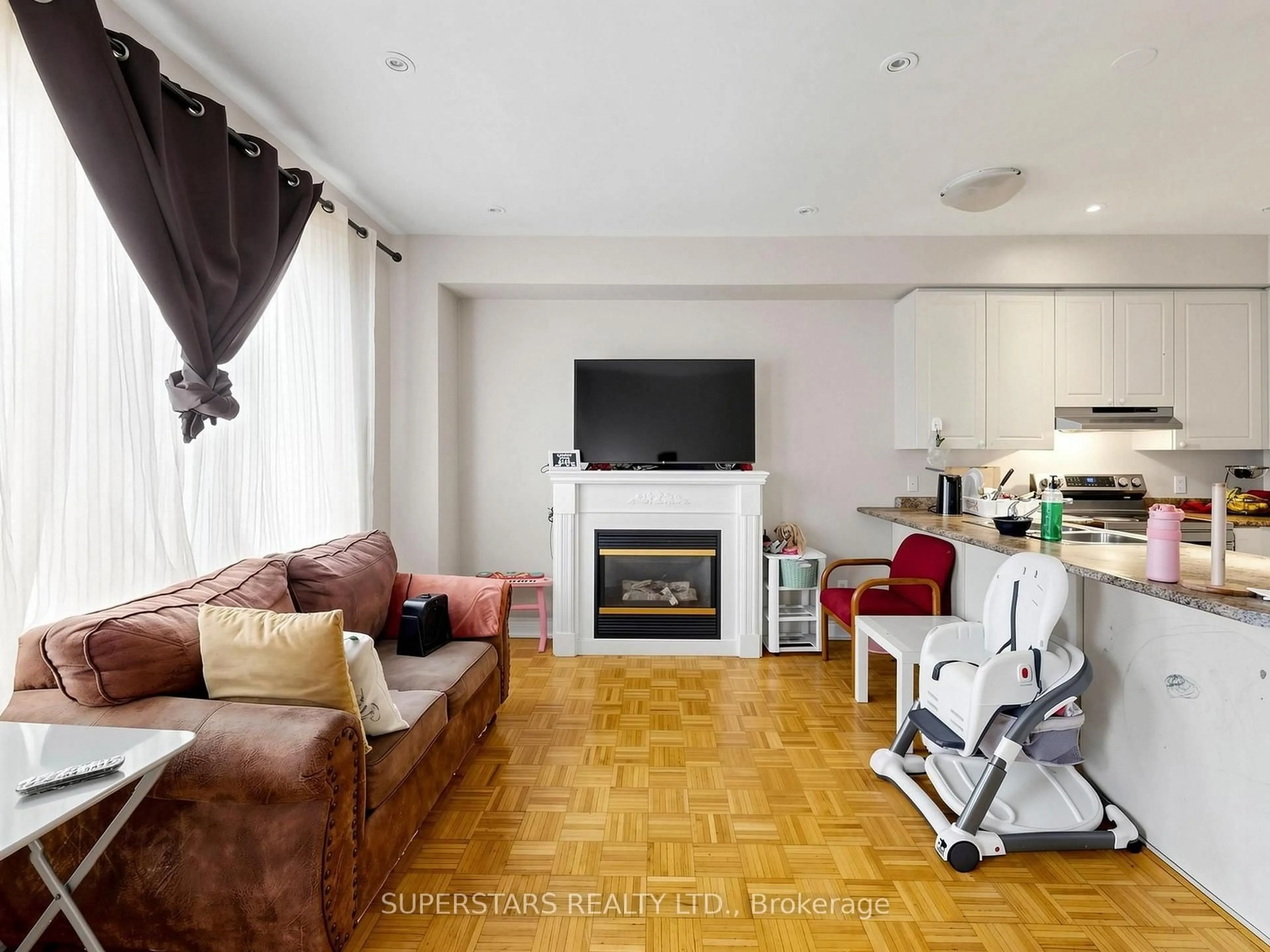 Living room with furniture, wood/laminate floor for 14 Bowsfield Rd, Toronto Ontario M3J 3R3