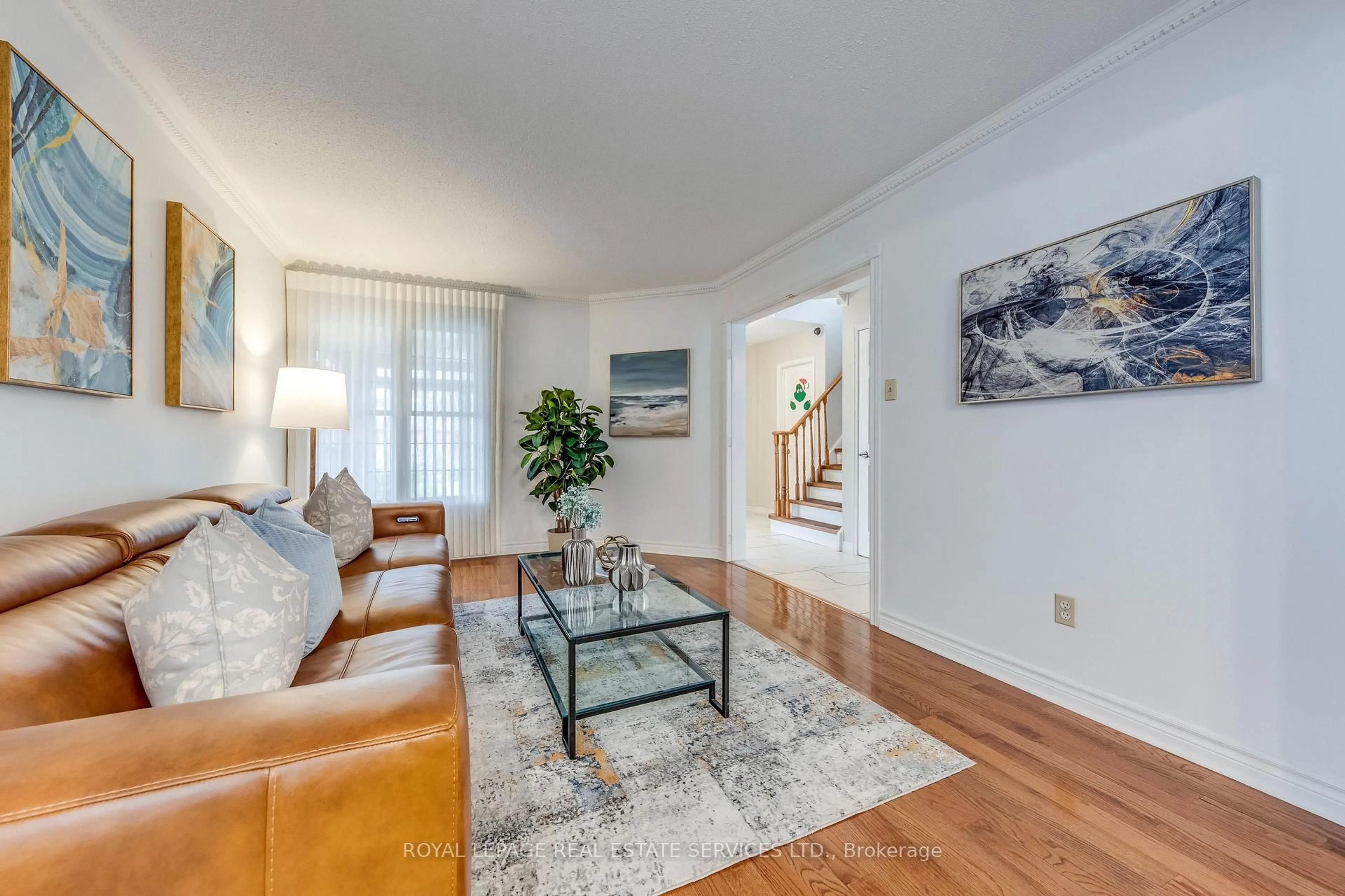 Living room with furniture, wood/laminate floor for 3390 Chartrand Cres, Mississauga Ontario L5L 4C4
