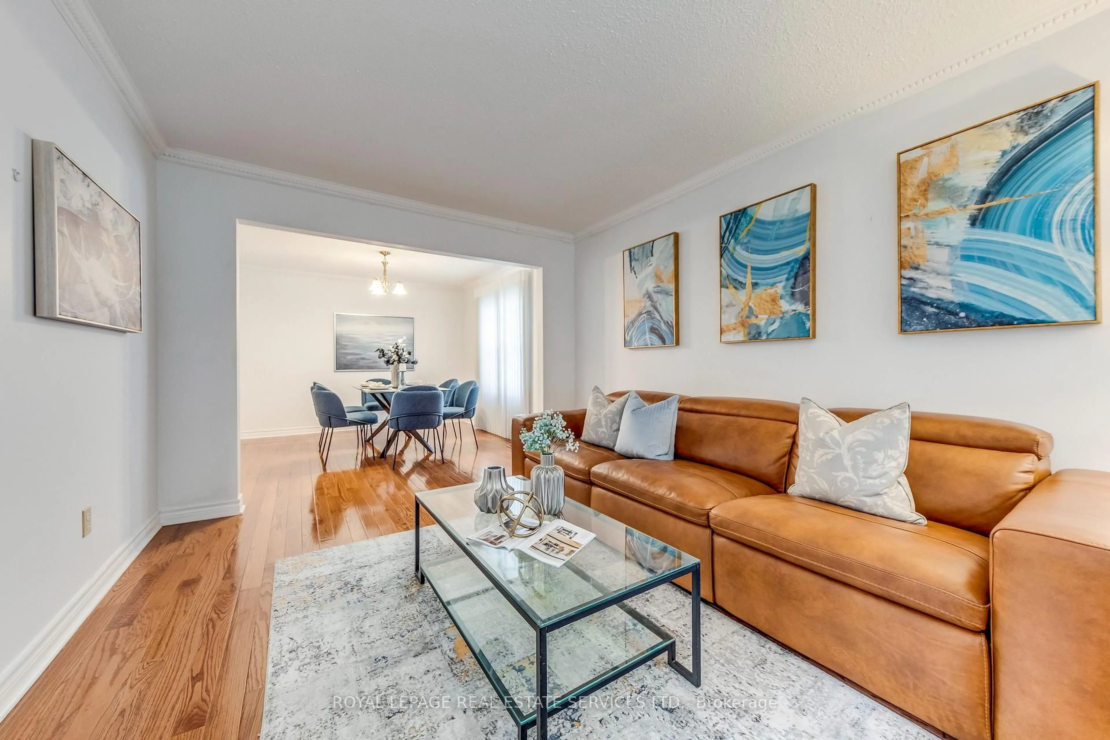 Living room with furniture, wood/laminate floor for 3390 Chartrand Cres, Mississauga Ontario L5L 4C4