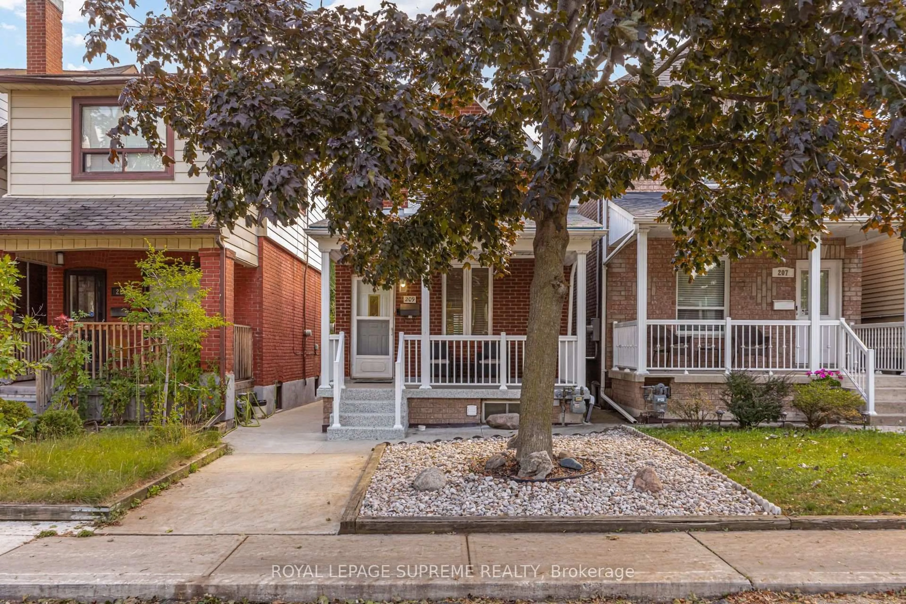 Home with brick exterior material, street for 209 Boon Ave, Toronto Ontario M6E 3Z7