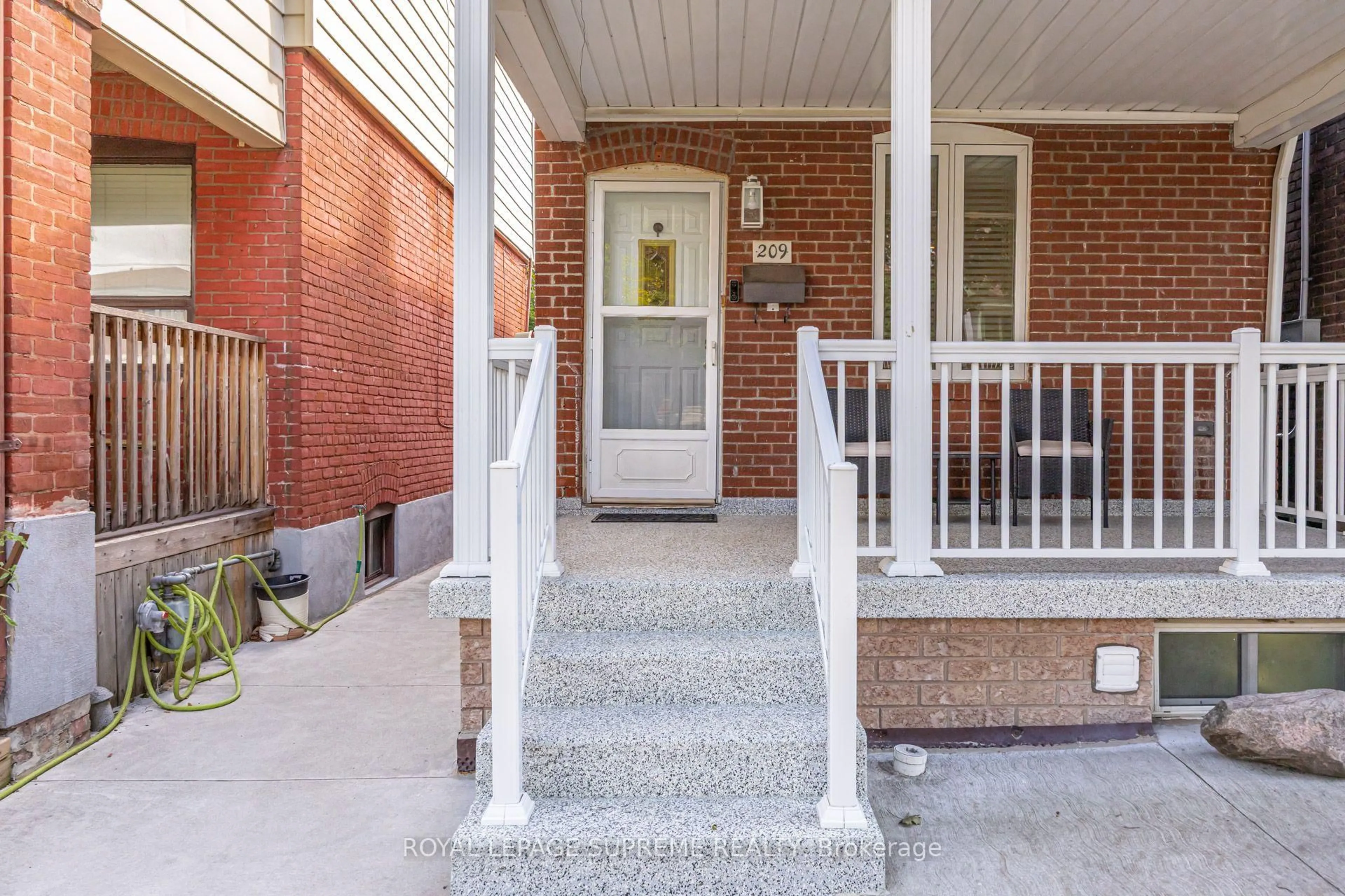 Home with brick exterior material, street for 209 Boon Ave, Toronto Ontario M6E 3Z7