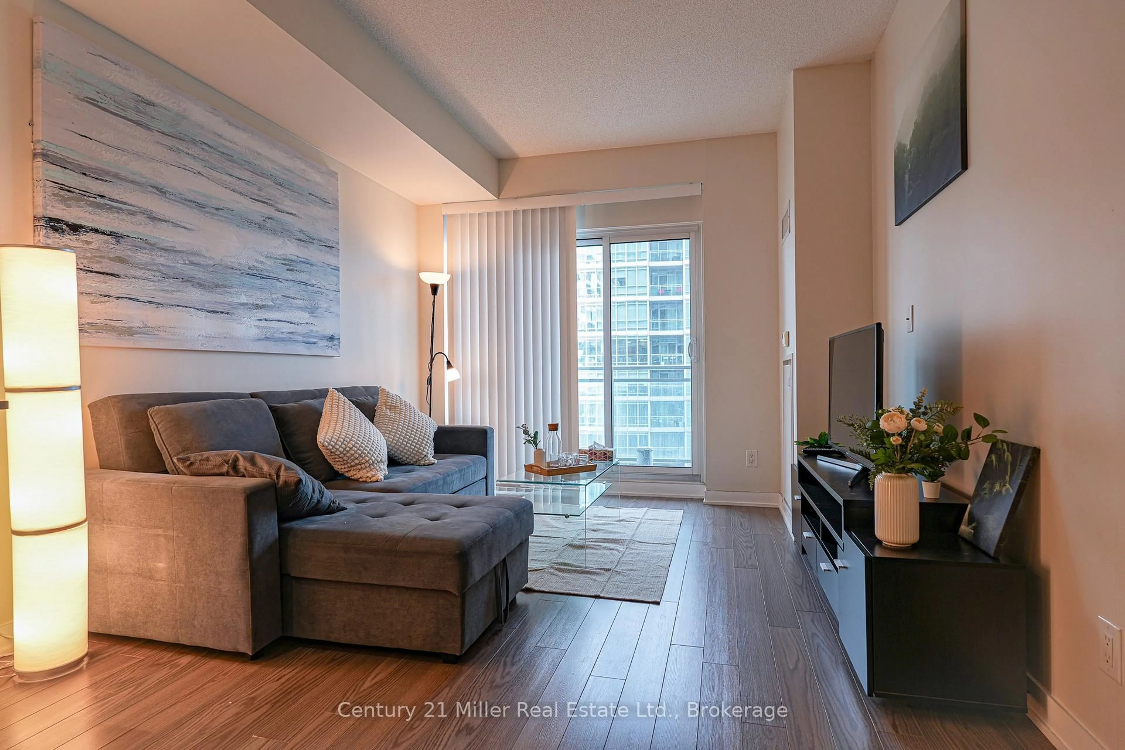 Living room with furniture, wood/laminate floor for 165 Legion Rd #1634, Toronto Ontario M8Y 0B3
