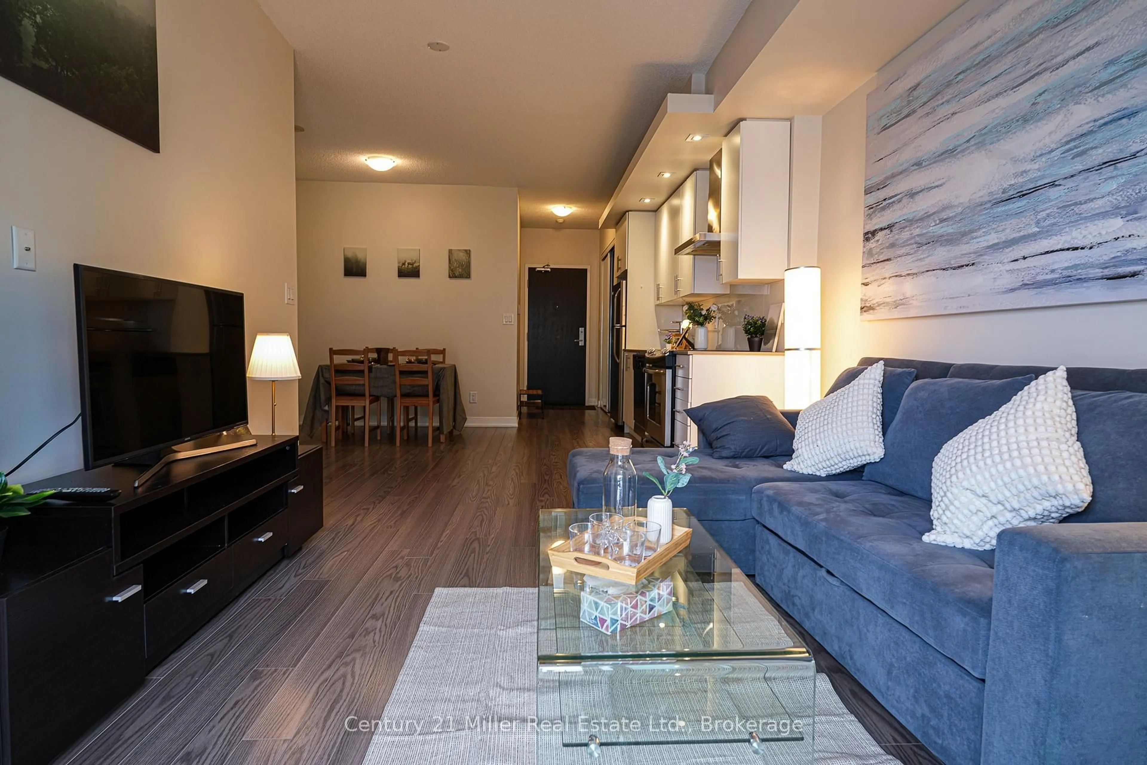 Living room with furniture, wood/laminate floor for 165 Legion Rd #1634, Toronto Ontario M8Y 0B3