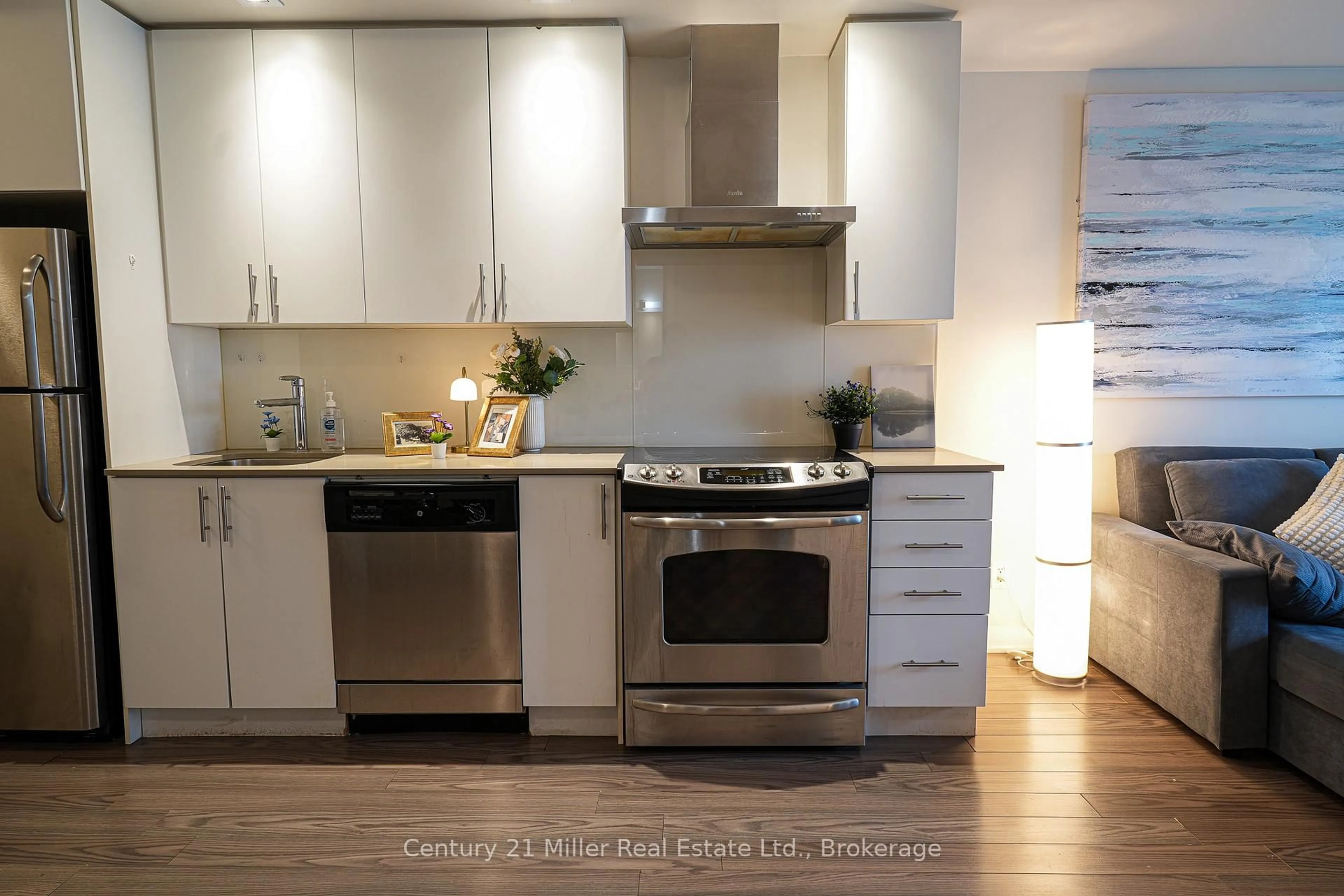 Open concept kitchen, wood/laminate floor for 165 Legion Rd #1634, Toronto Ontario M8Y 0B3