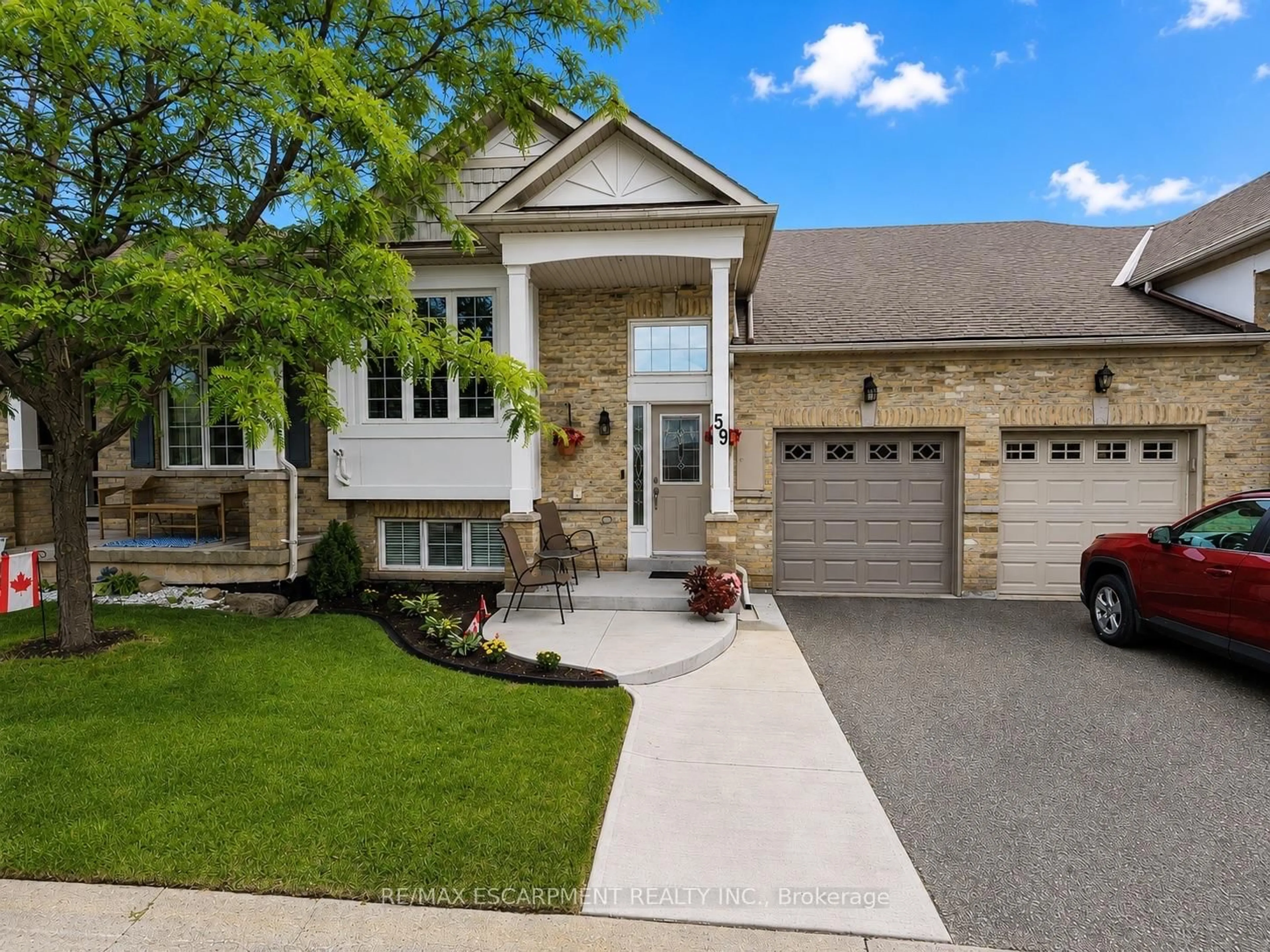 Home with brick exterior material, street for 2243 Turnberry Rd #59, Burlington Ontario L7M 4Y6