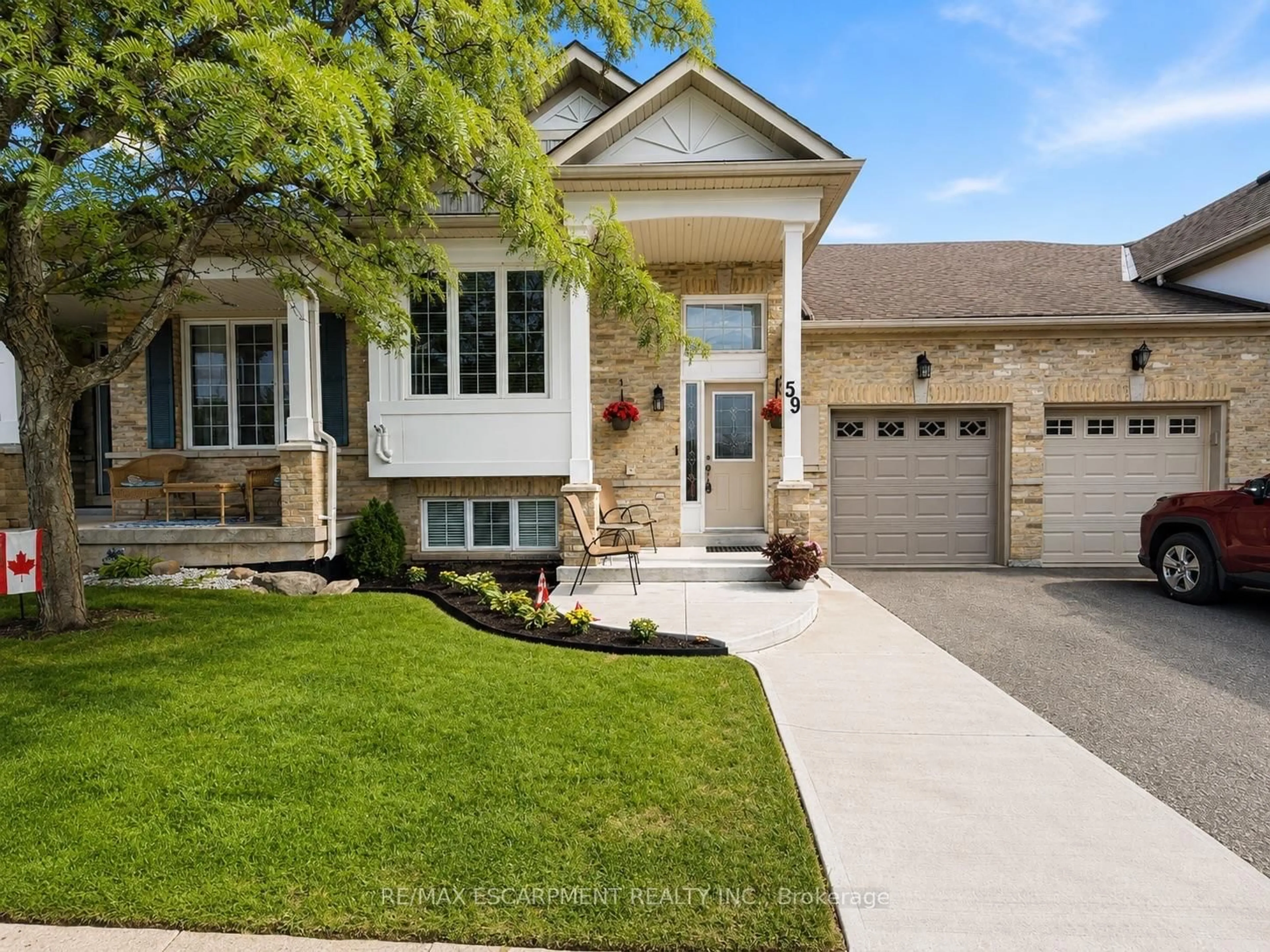 Home with brick exterior material, street for 2243 Turnberry Rd #59, Burlington Ontario L7M 4Y6