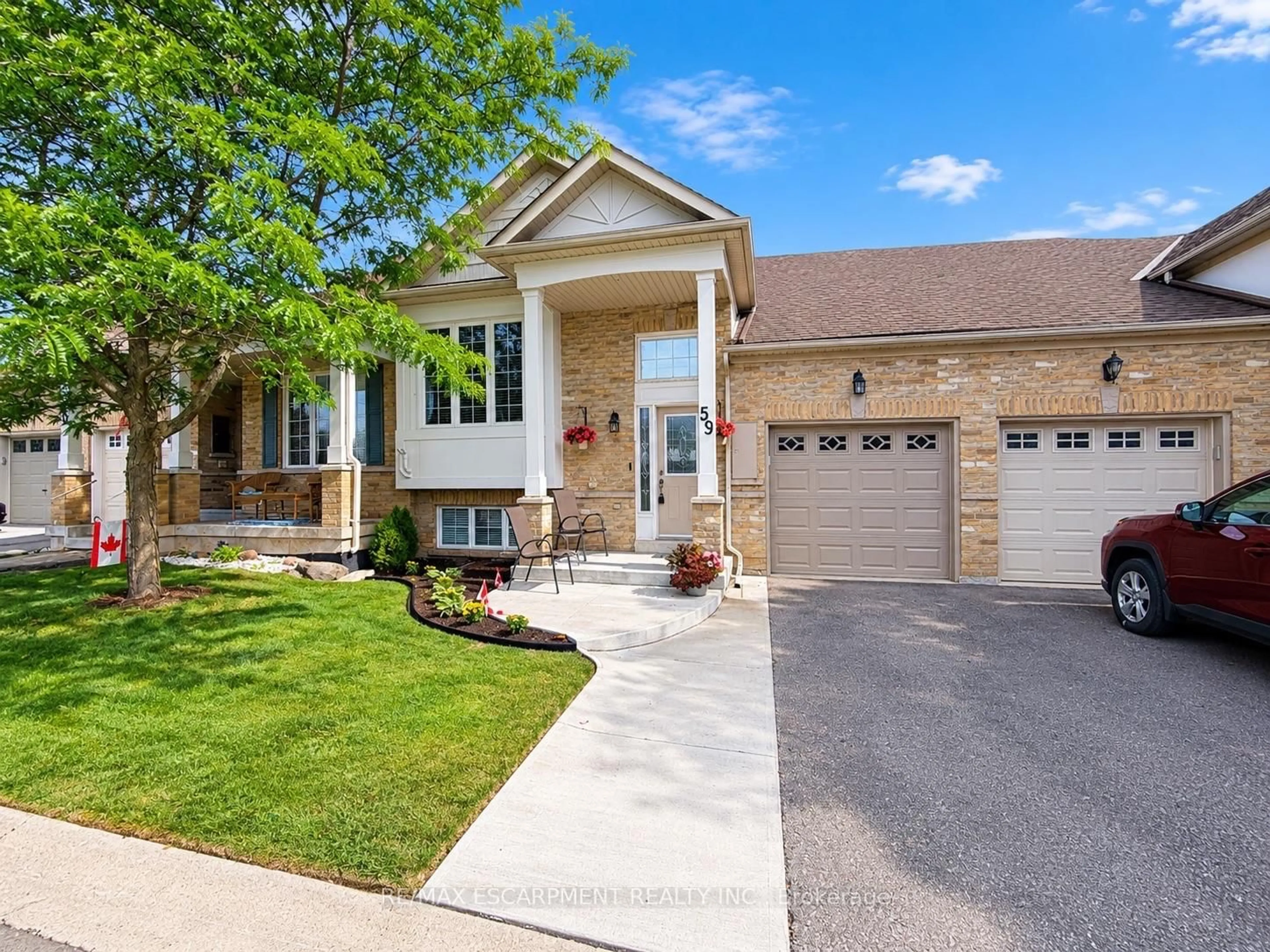 Home with brick exterior material, street for 2243 Turnberry Rd #59, Burlington Ontario L7M 4Y6