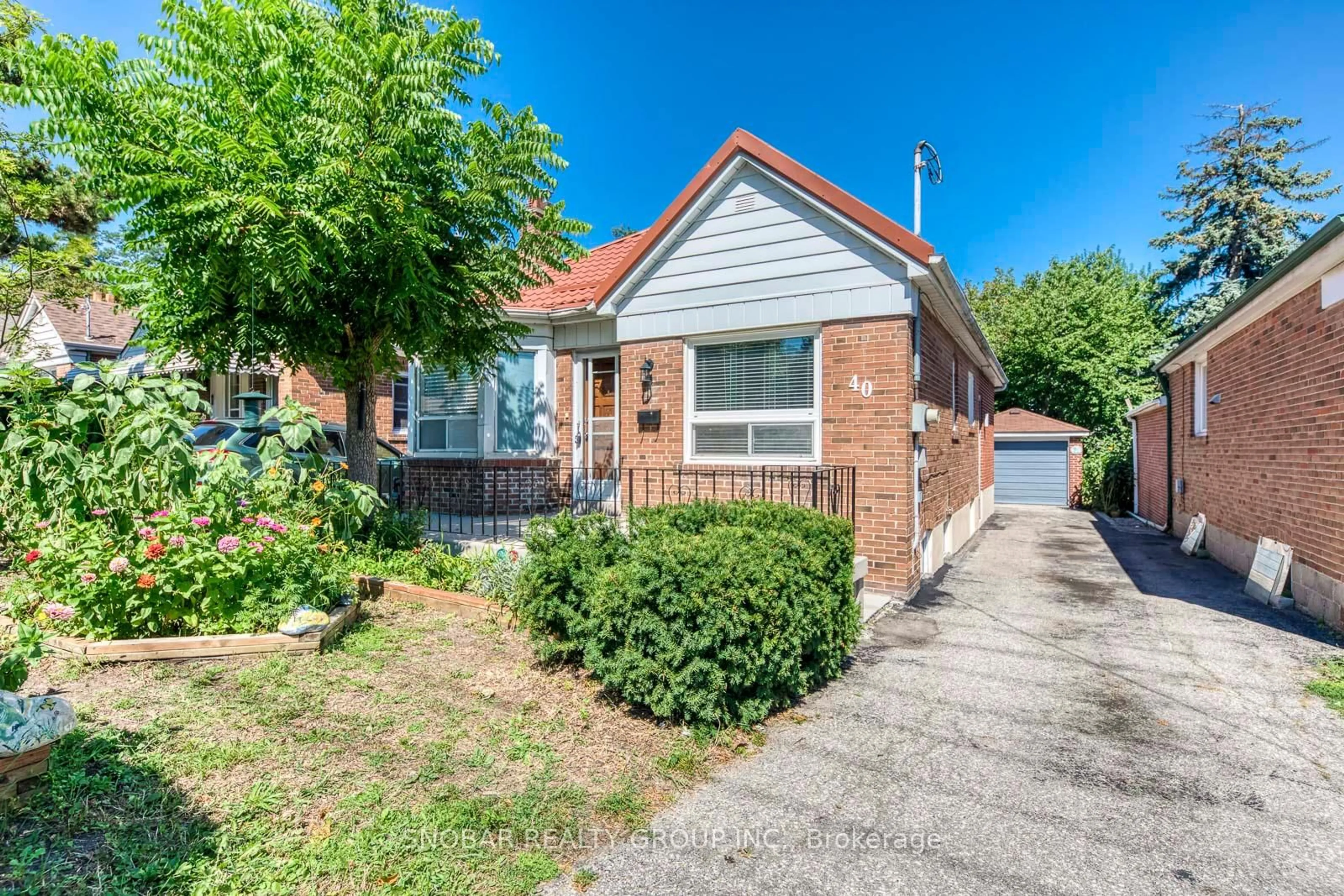 Home with brick exterior material, street for 40 Dixon Rd, Toronto Ontario M9P 2L3