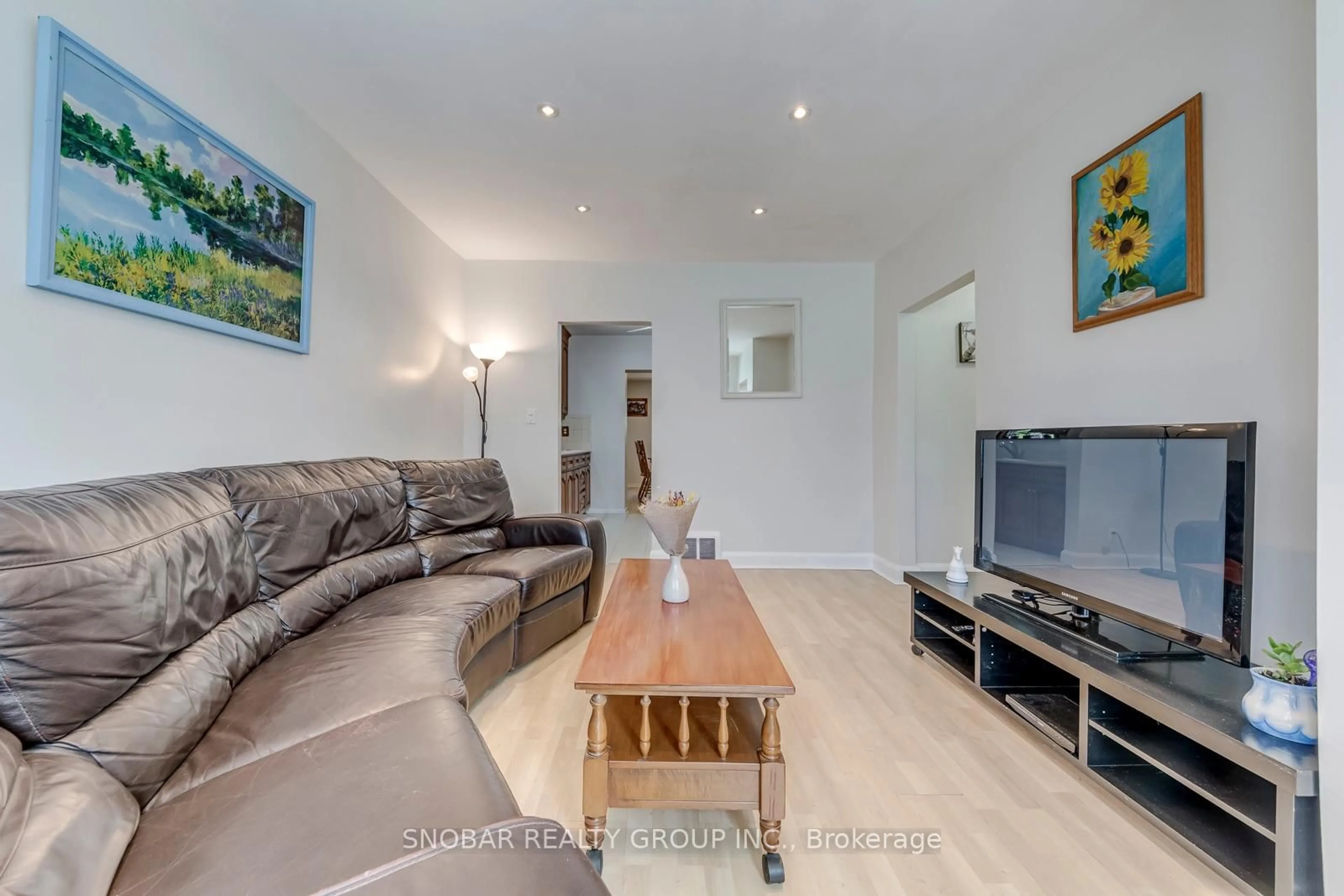 Living room with furniture, wood/laminate floor for 40 Dixon Rd, Toronto Ontario M9P 2L3