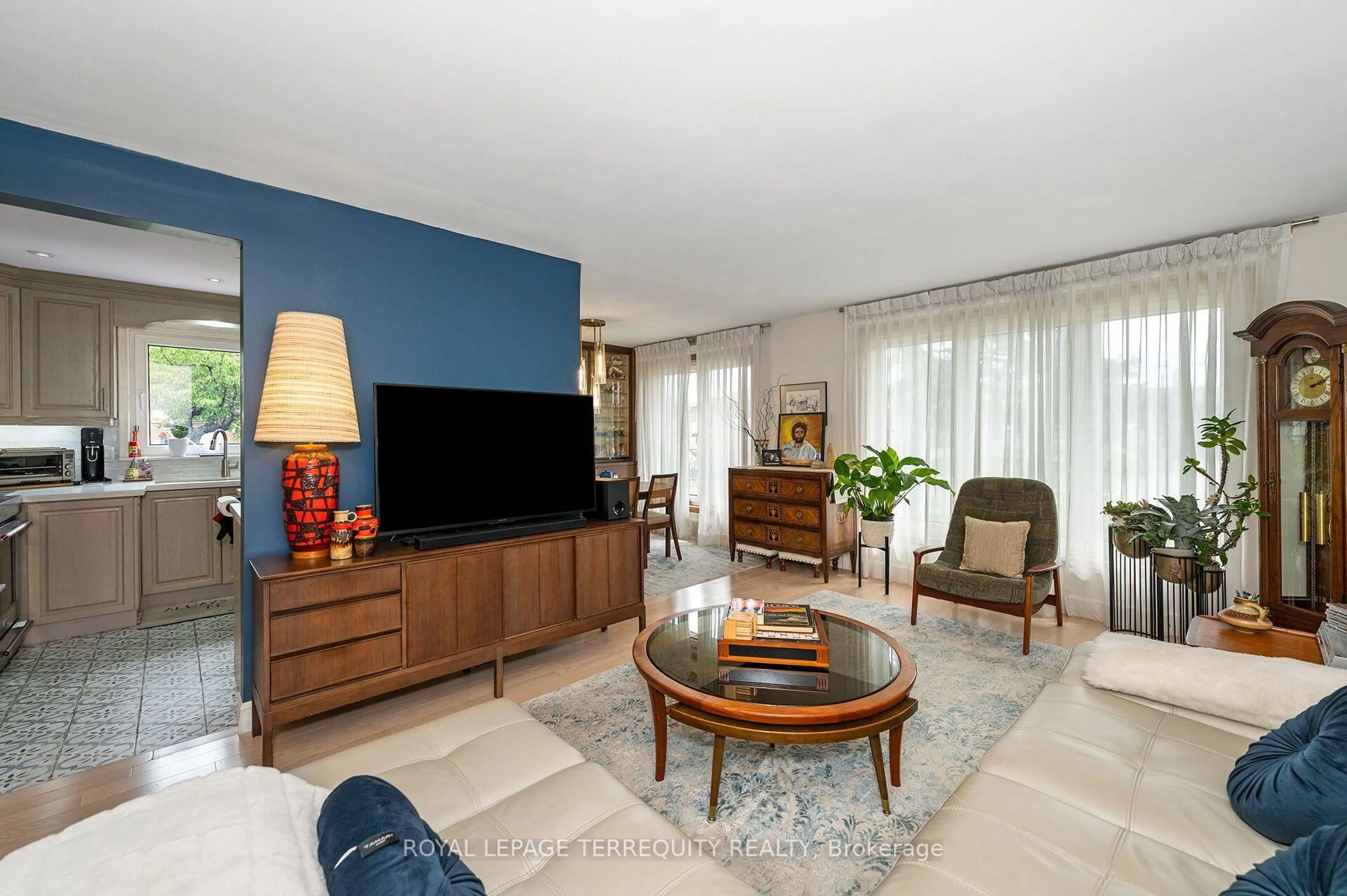 Living room with furniture, ceramic/tile floor for 120 Falstaff Ave, Toronto Ontario M6L 2E4
