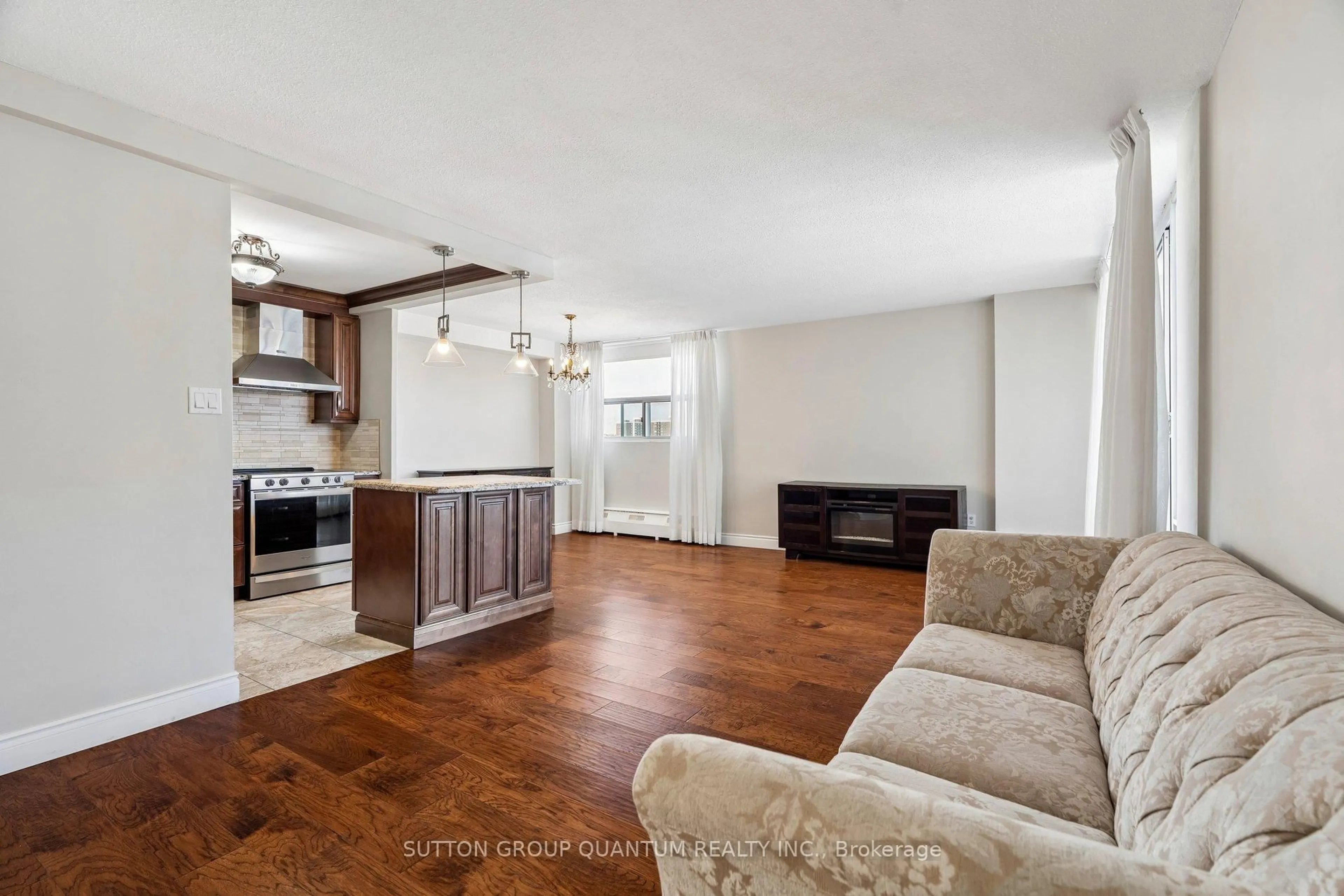 Living room with furniture, wood/laminate floor for 2345 Confederation Pkwy #802, Mississauga Ontario L5B 2H3