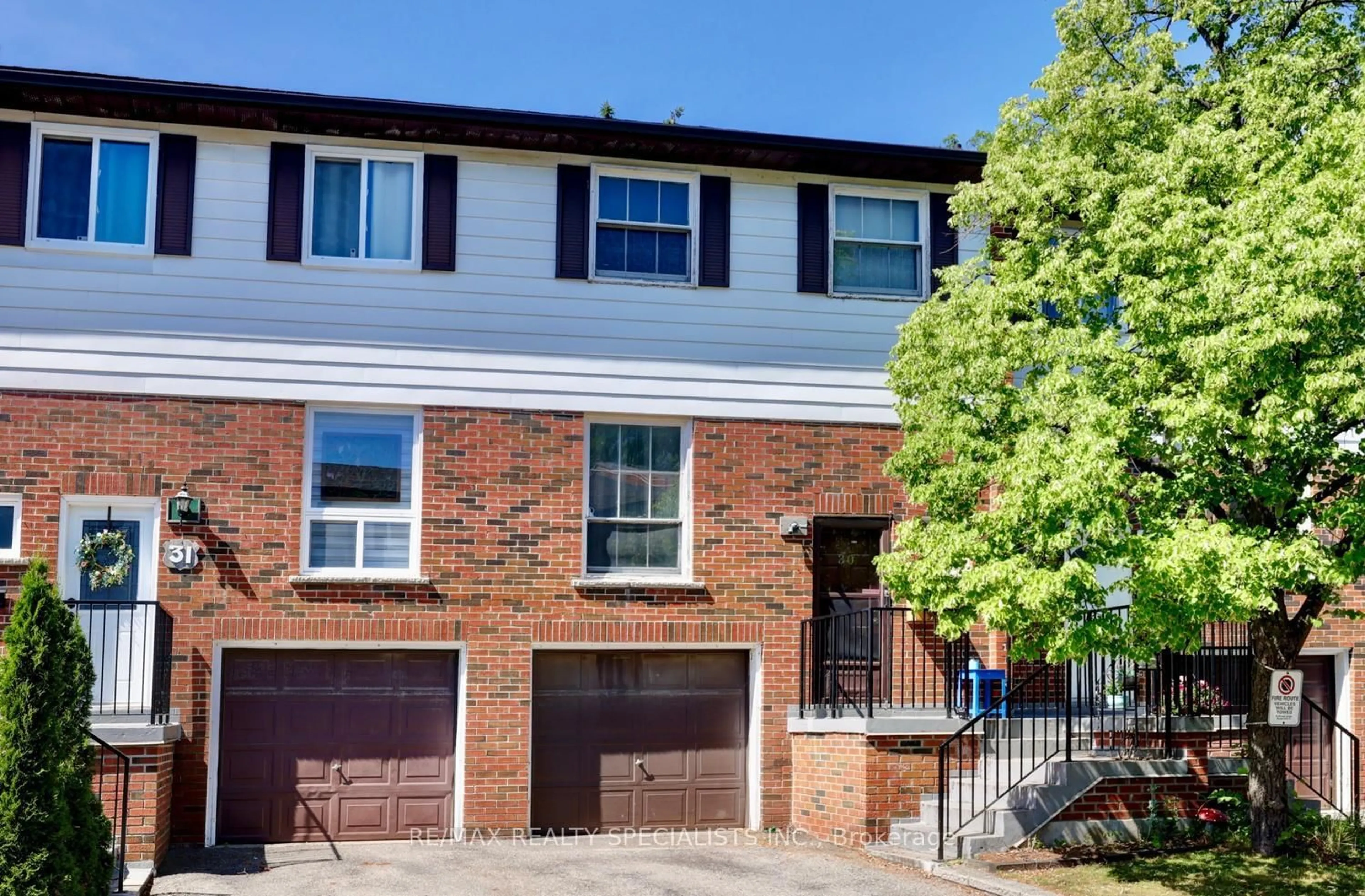 Home with brick exterior material, street for 2445 Homelands Dr #30, Mississauga Ontario L5K 2C6