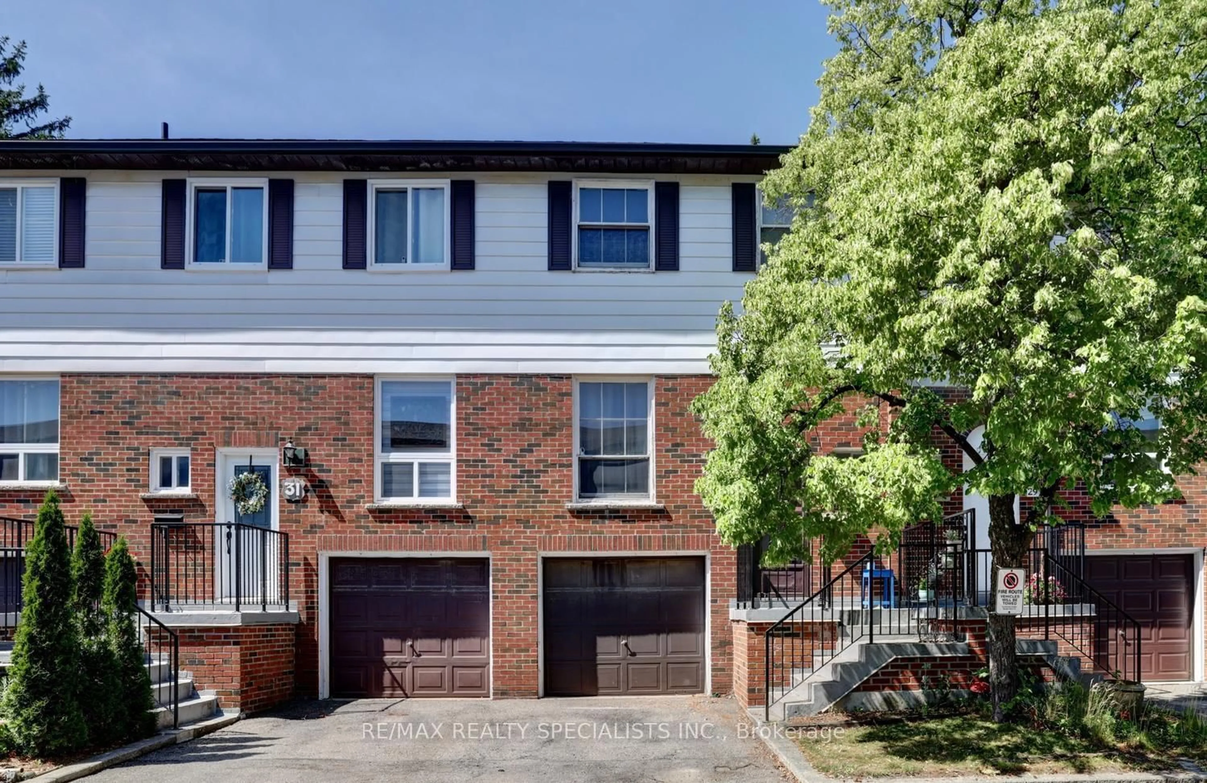 Home with brick exterior material, street for 2445 Homelands Dr #30, Mississauga Ontario L5K 2C6