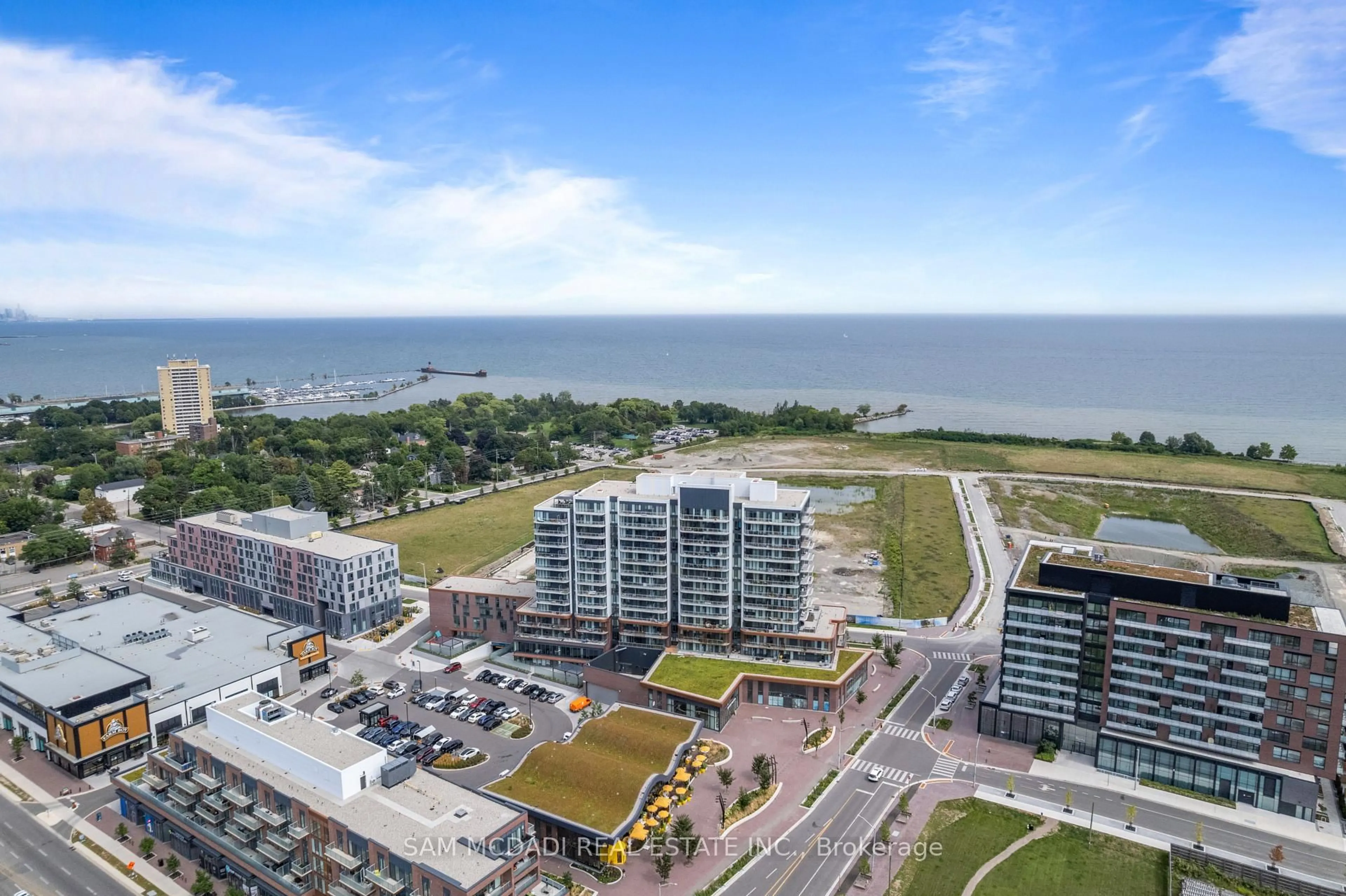 A pic from outside/outdoor area/front of a property/back of a property/a pic from drone, water/lake/river/ocean view for 220 Missinnihe Way #304, Mississauga Ontario L5H 0A9
