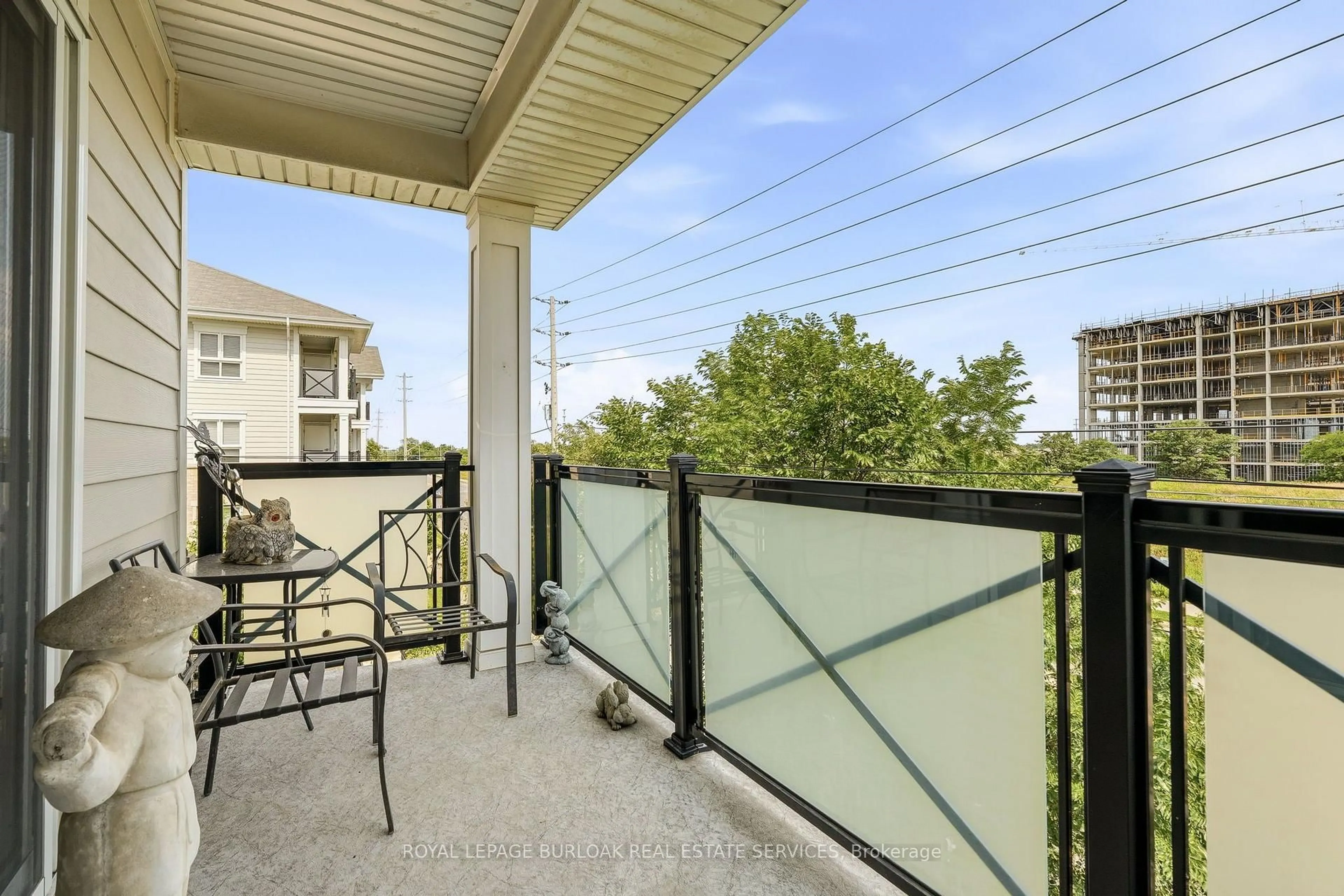 Balcony in the apartment, city buildings view from balcony for 1045 Nadalin Hts #309, Milton Ontario L9T 8R5