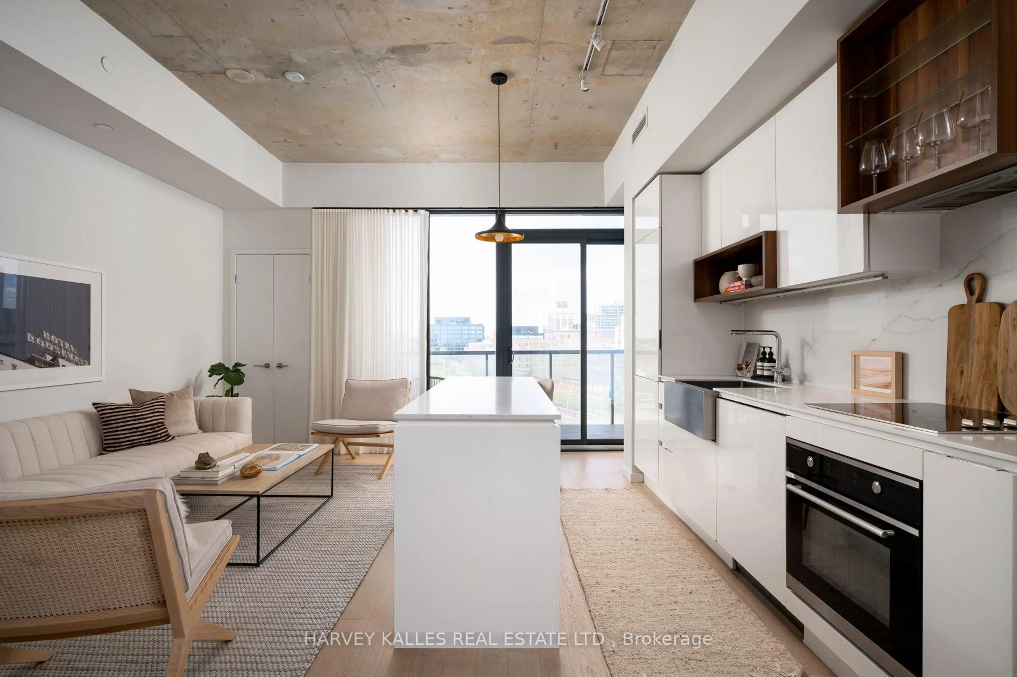 Open concept kitchen, cement floor for 383 Sorauren Ave #809, Toronto Ontario M6R 0A4