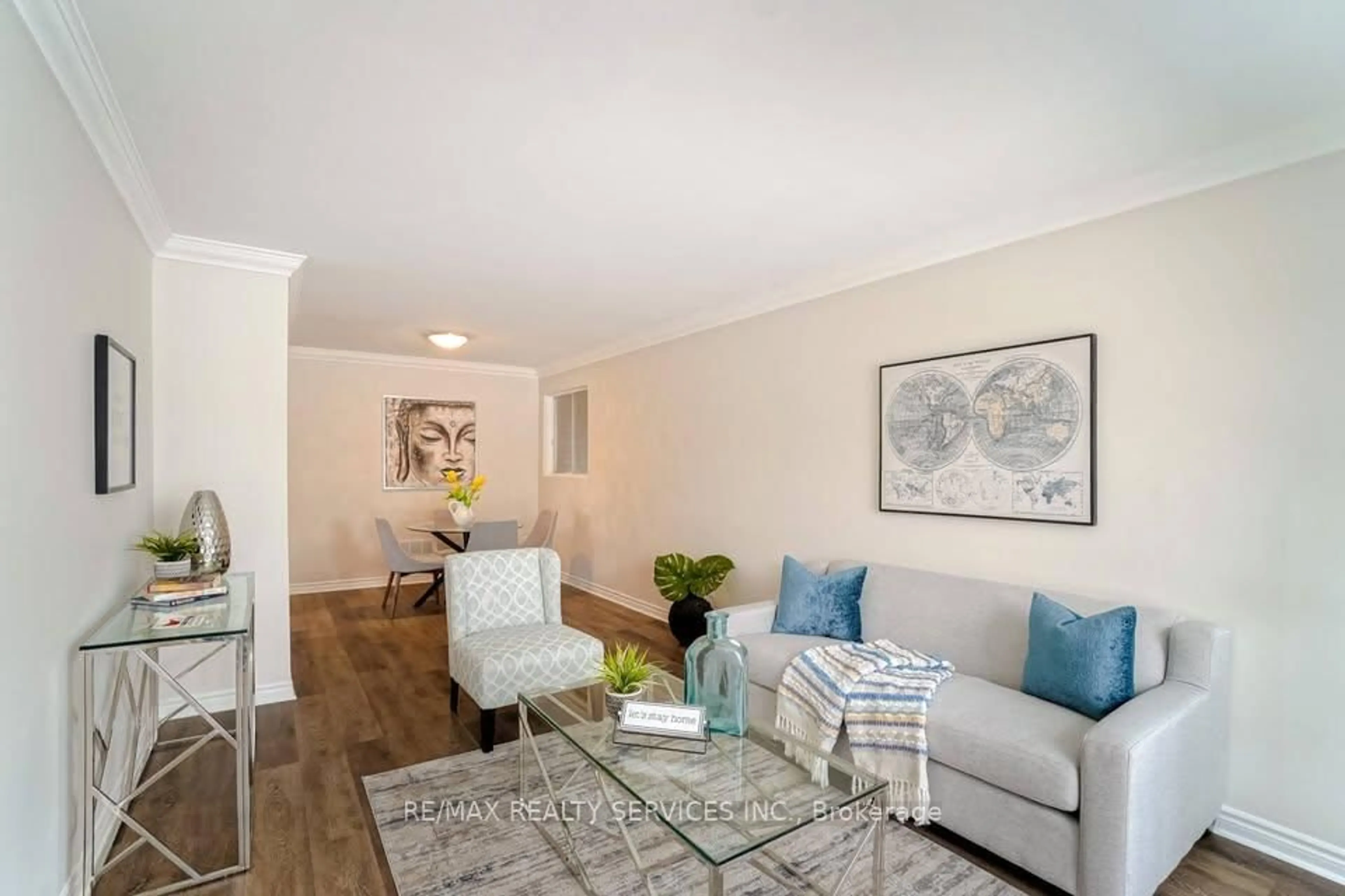 Living room with furniture, wood/laminate floor for 70 Montjoy Cres, Brampton Ontario L6S 3E7
