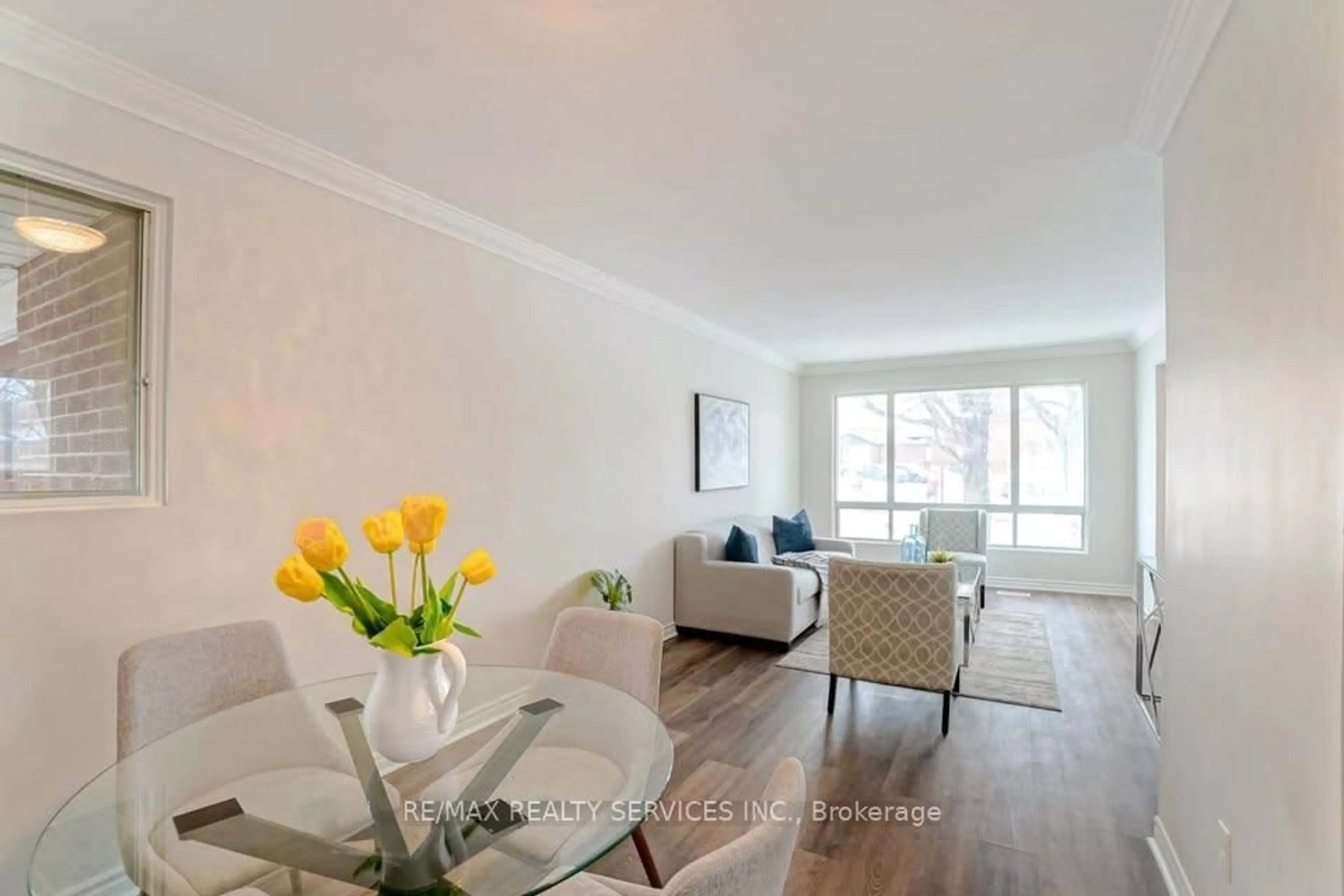Living room with furniture, wood/laminate floor for 70 Montjoy Cres, Brampton Ontario L6S 3E7