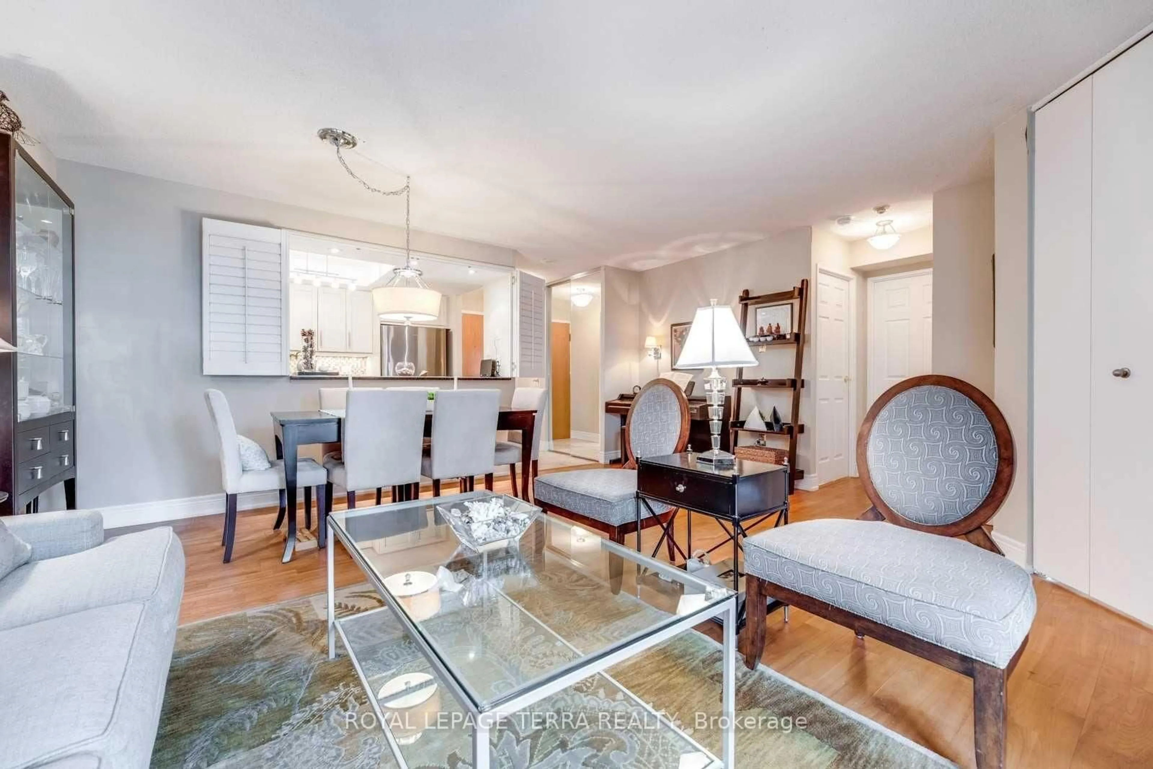 Living room with furniture, wood/laminate floor for 300 Webb Dr #201, Mississauga Ontario L5B 3W3