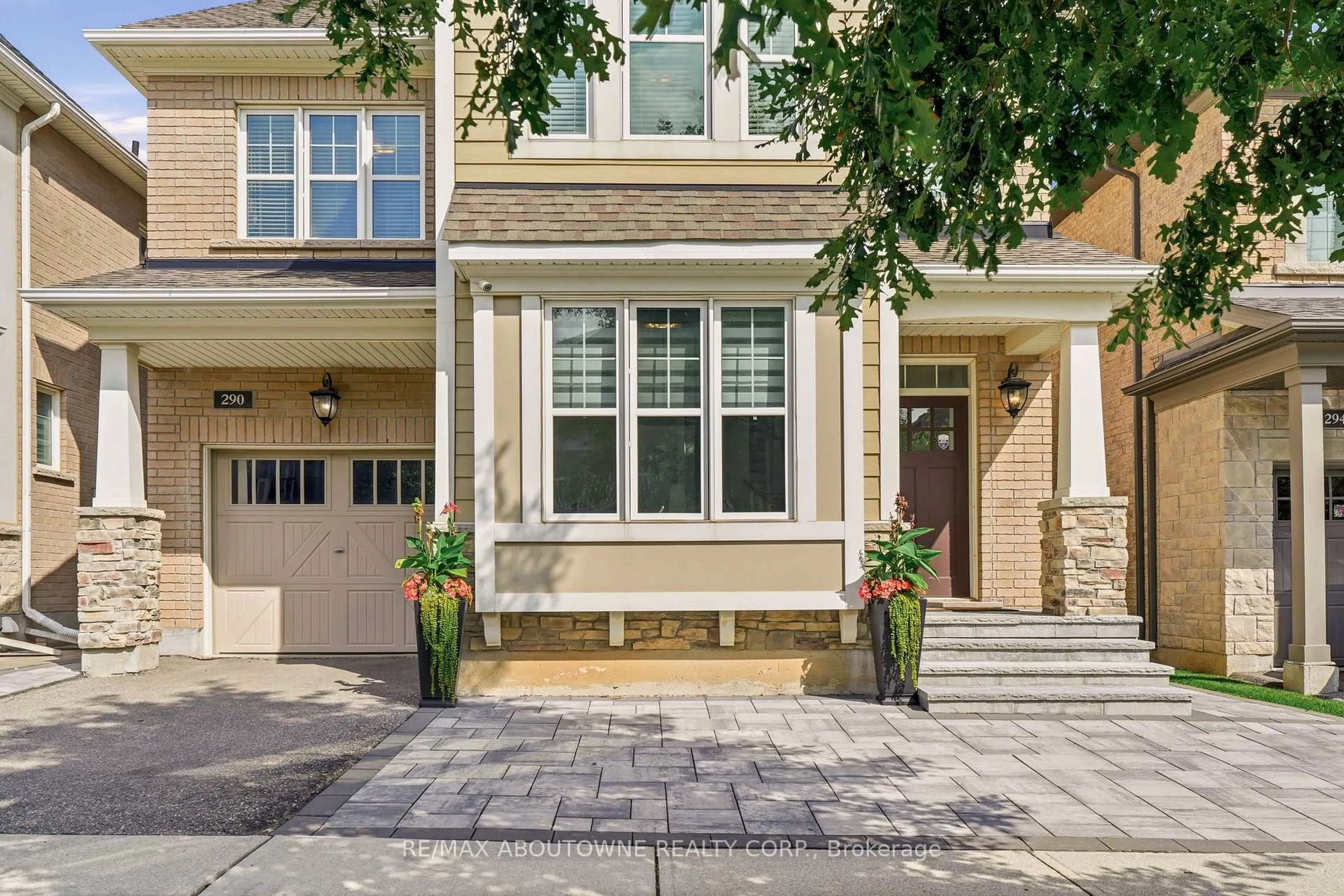 Home with brick exterior material, street for 290 Wisteria Way, Oakville Ontario L6M 1L6