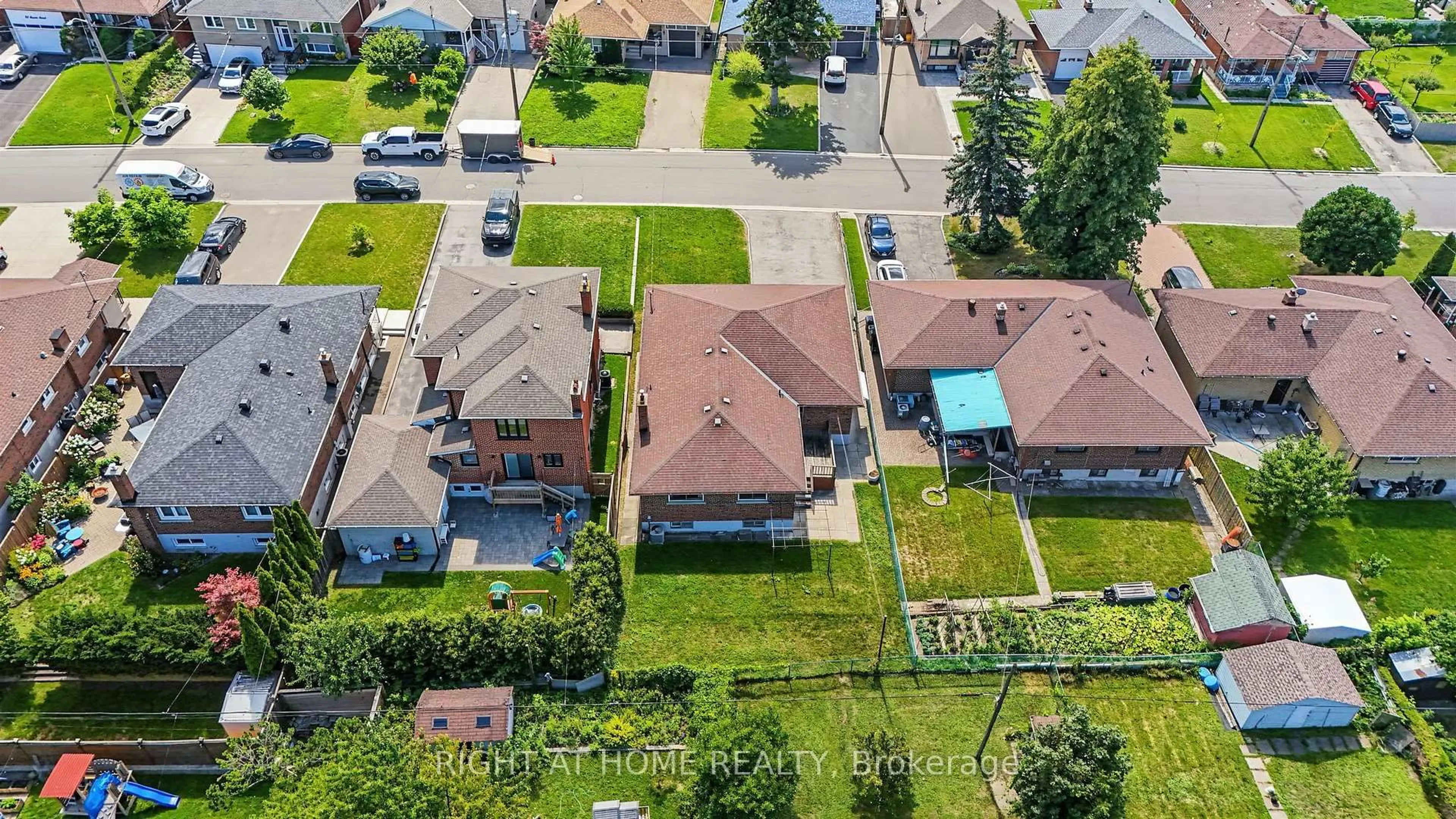 A pic from outside/outdoor area/front of a property/back of a property/a pic from drone, street for 84 Raven Rd, Toronto Ontario M6L 2A7