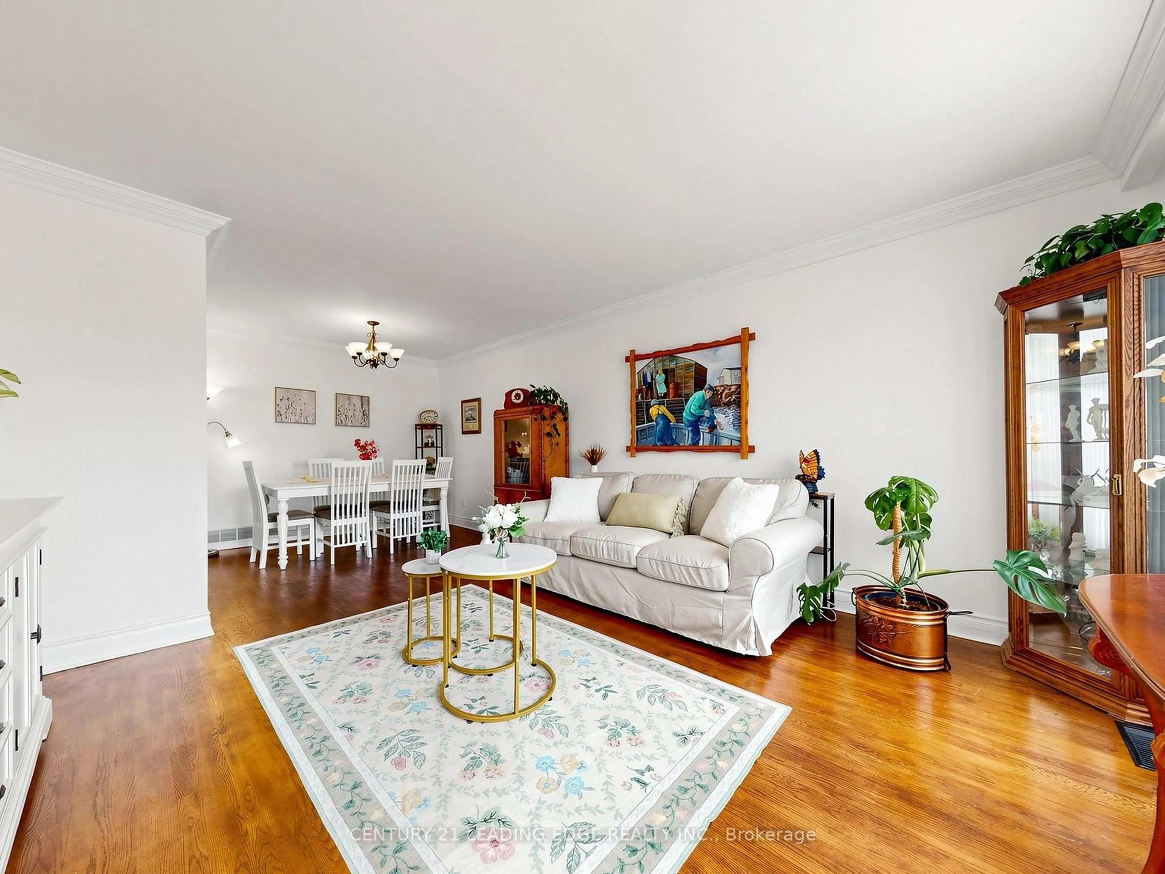 Living room with furniture, wood/laminate floor for 17 Tinton Cres, Toronto Ontario M9V 2H9