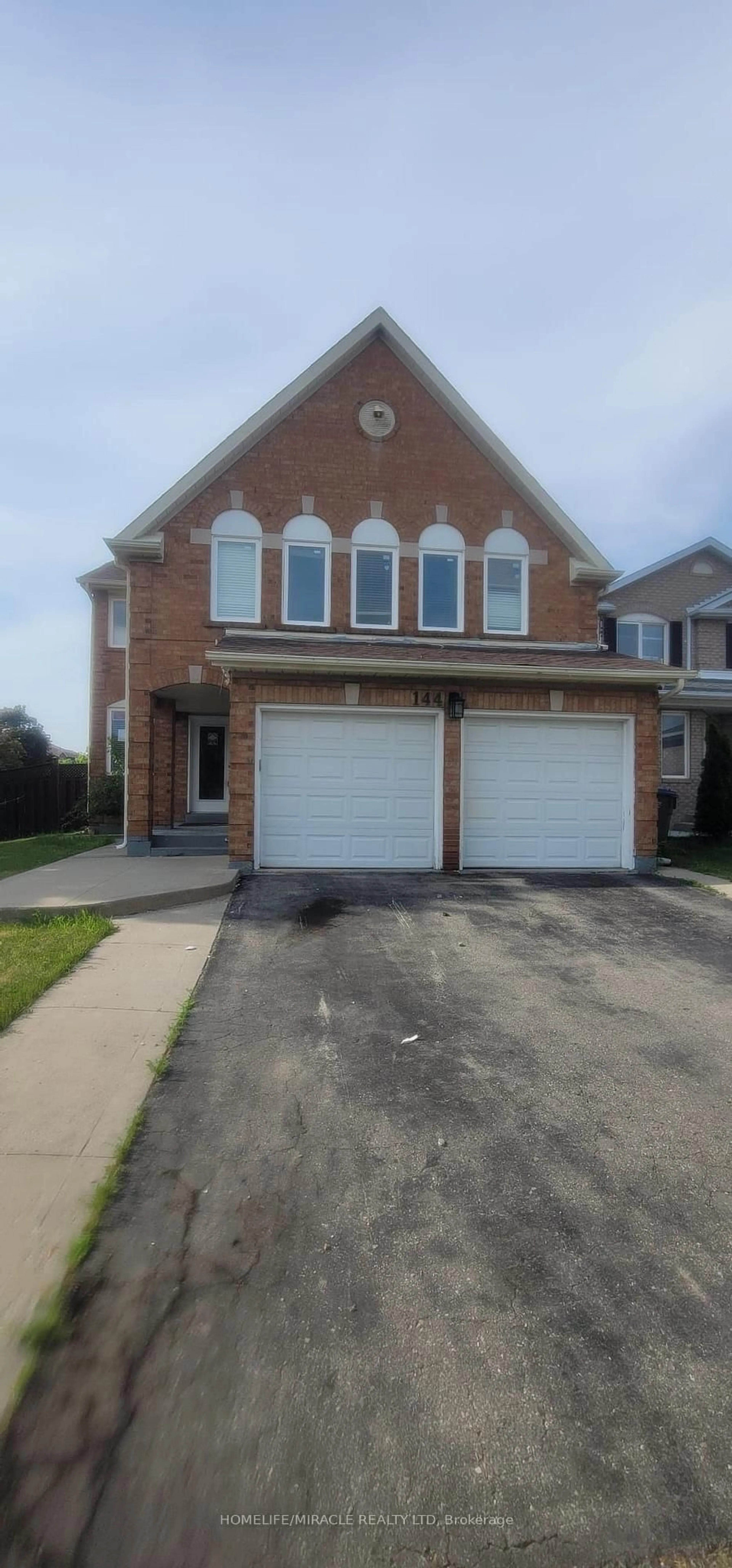 Home with brick exterior material, street for 144 Moffatt Ave, Brampton Ontario L6Y 4R8