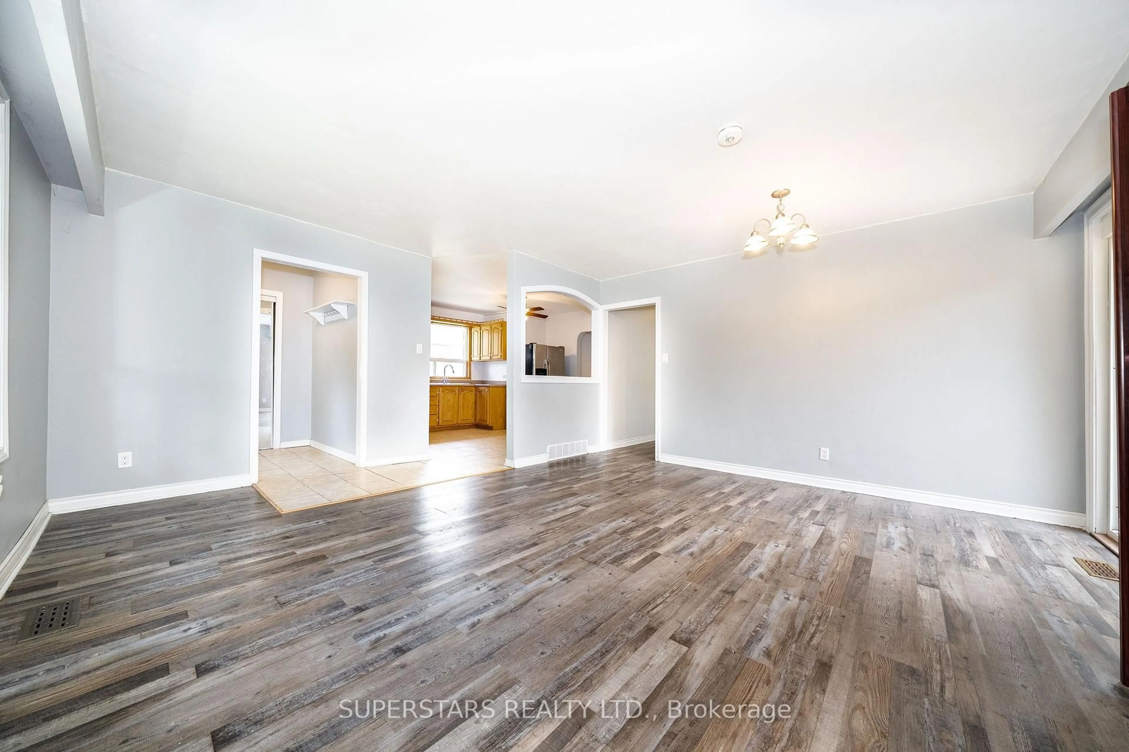 Open concept kitchen, wood/laminate floor for 6 Meadowland Dr, Brampton Ontario L6W 2R4