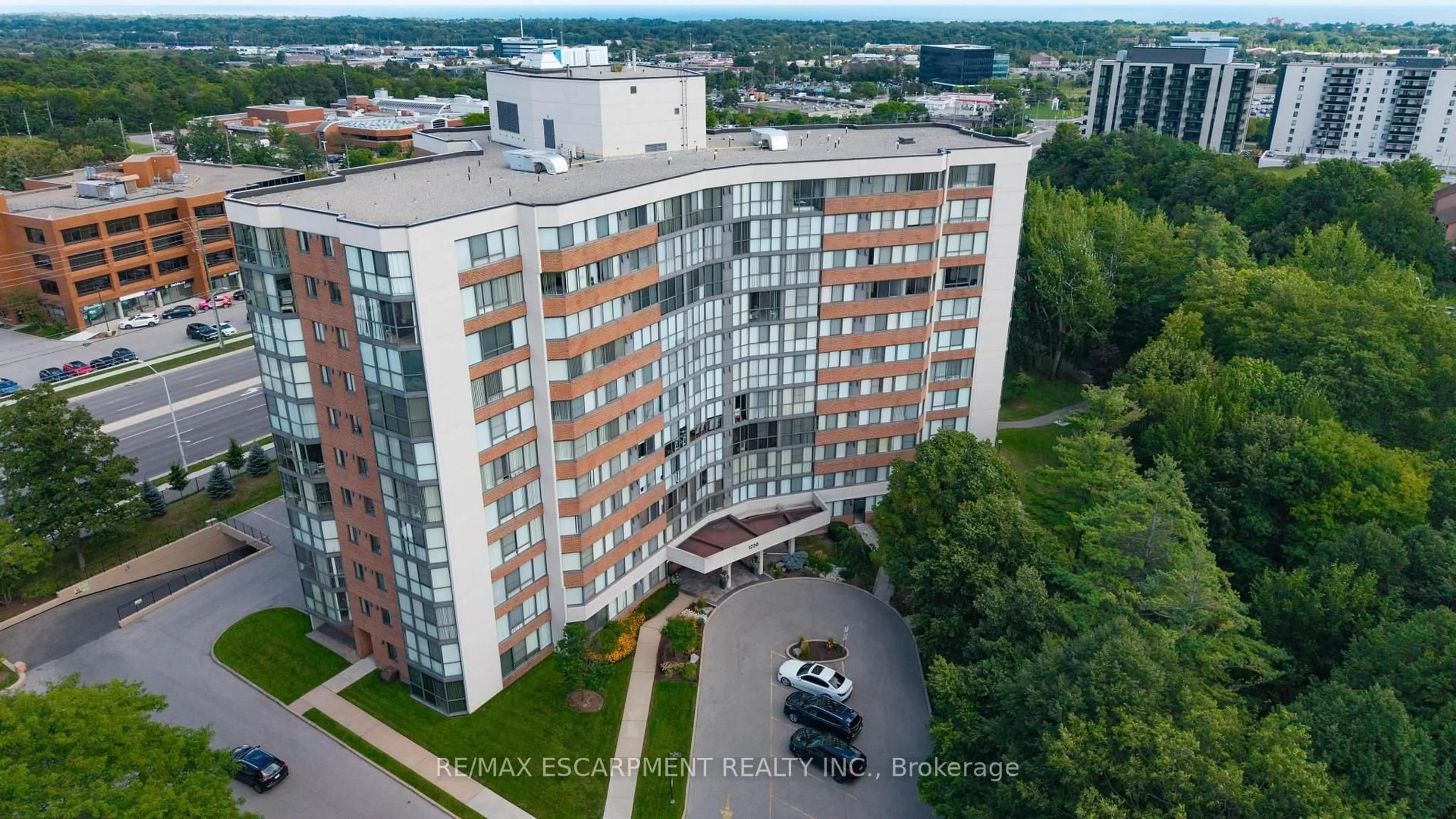 A pic from outside/outdoor area/front of a property/back of a property/a pic from drone, city buildings view from balcony for 1230 Marlborough Crt #202, Oakville Ontario L6H 3K6