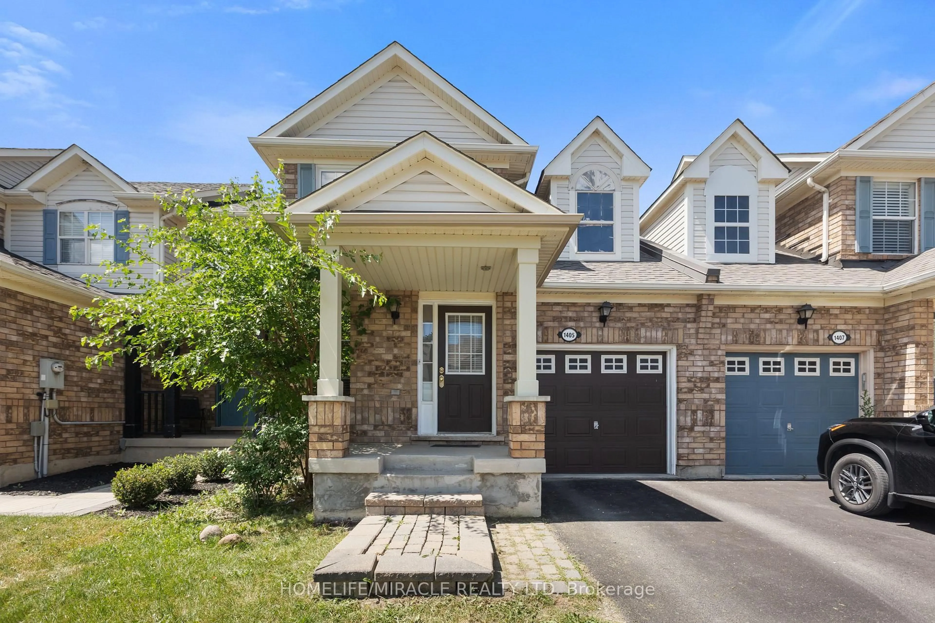 Home with brick exterior material, street for 1405 MCDERMOTT Way, Milton Ontario L9T 6L6