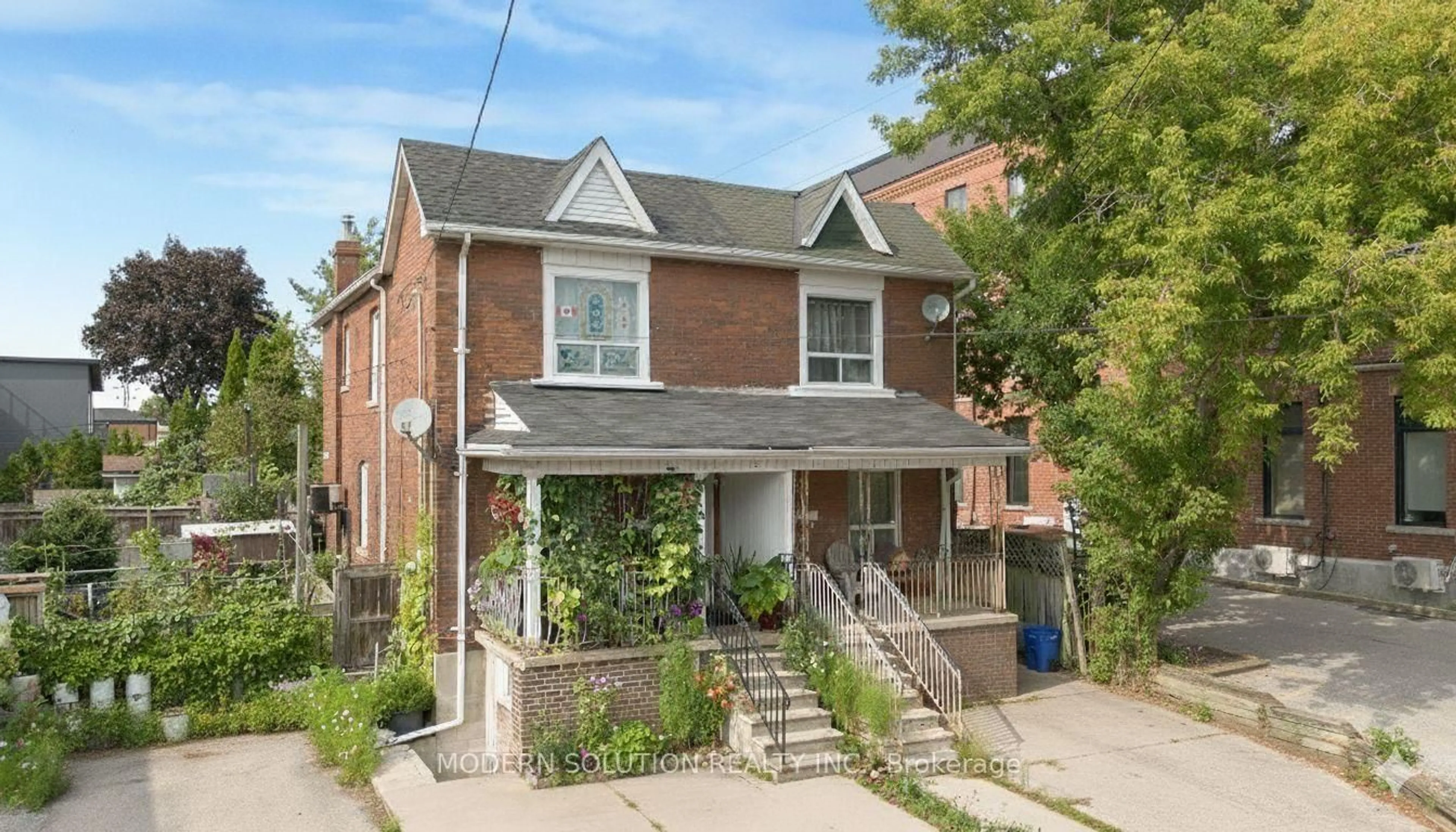 Home with brick exterior material, street for 2 Rockwell Ave, Toronto Ontario M6N 1N3