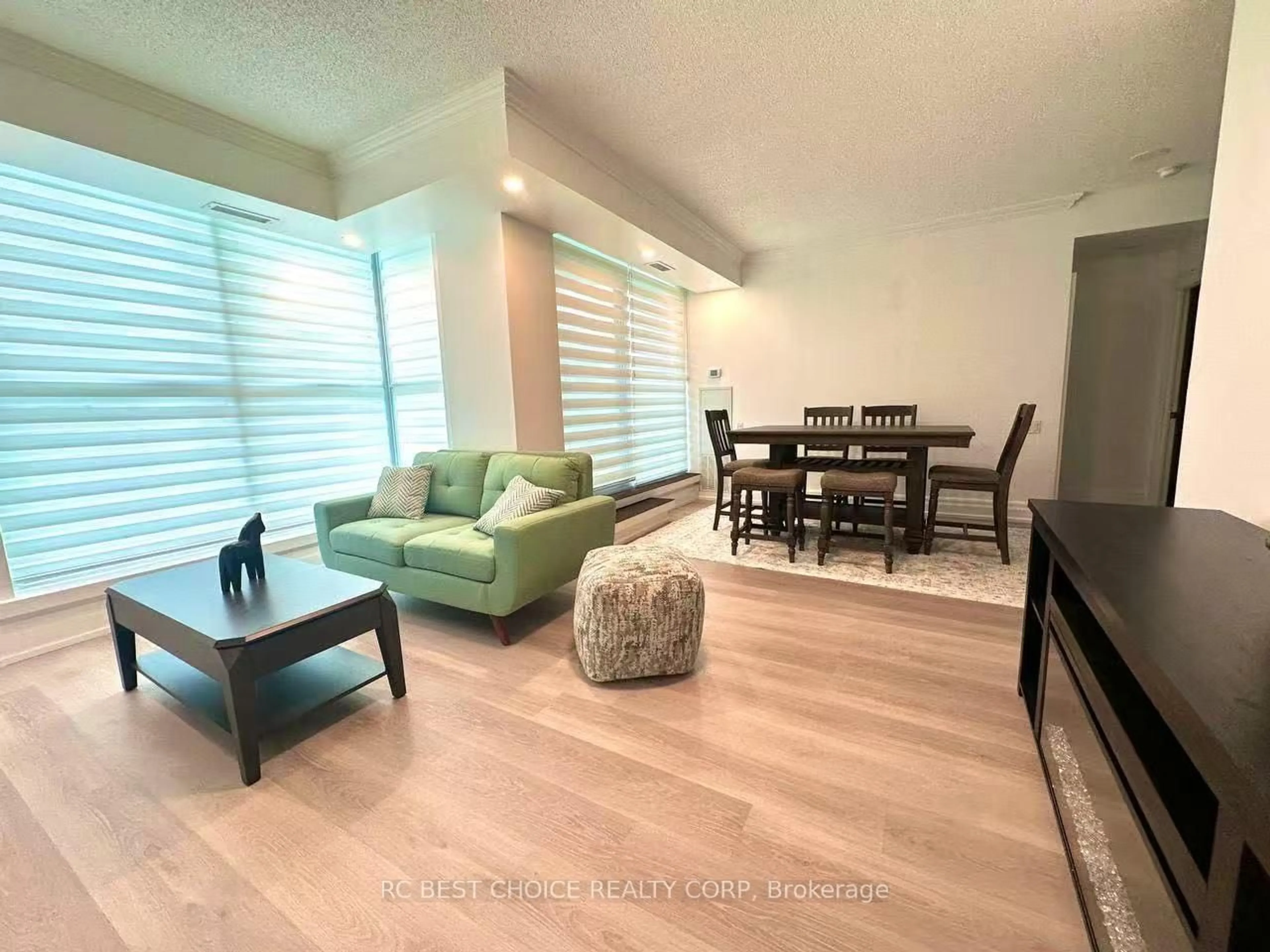 Living room with furniture, wood/laminate floor for 2067 Lake Shore Blvd #203, Toronto Ontario M8V 4B8