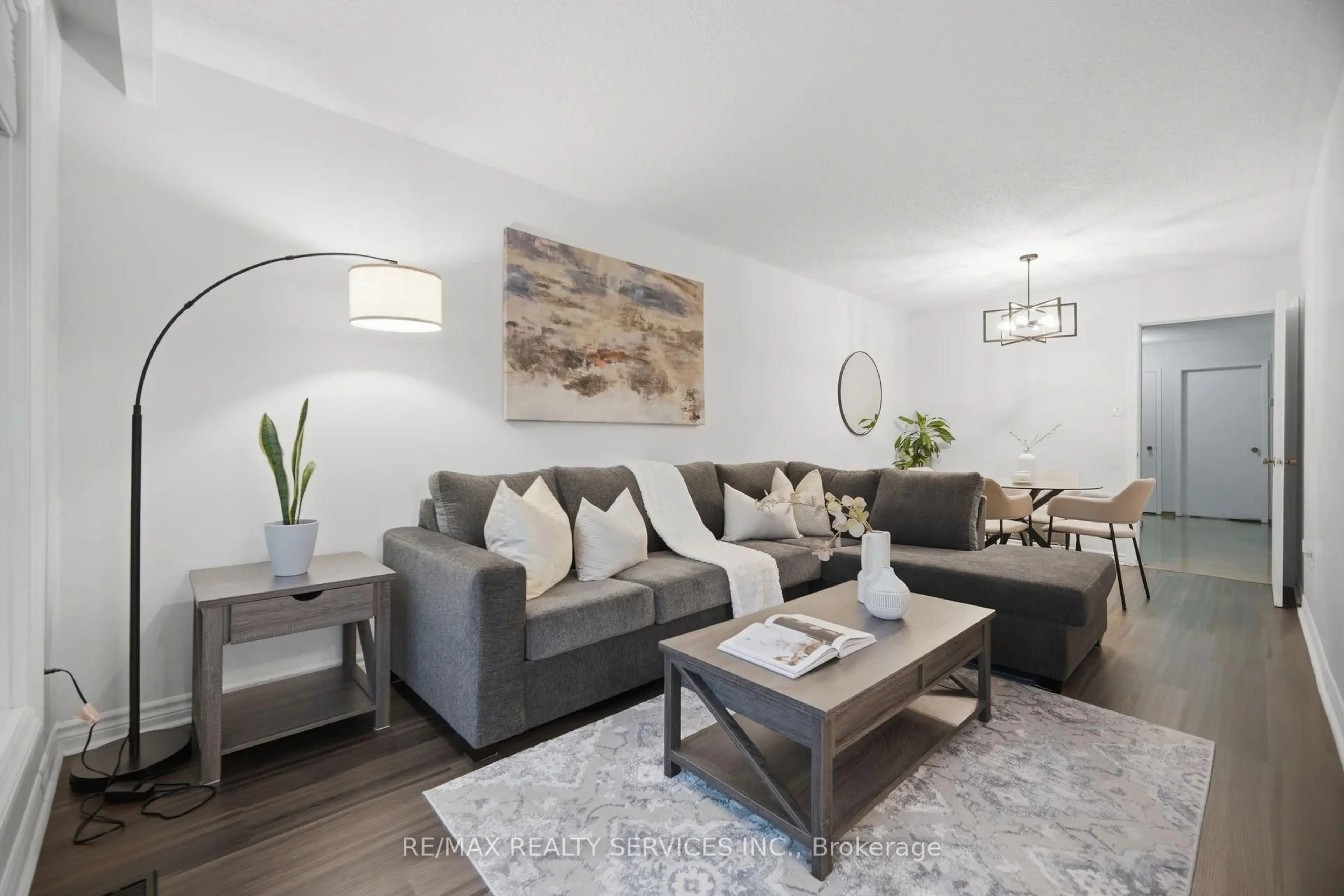 Living room with furniture, wood/laminate floor for 2414 Whaley Dr, Mississauga Ontario L5B 2B5