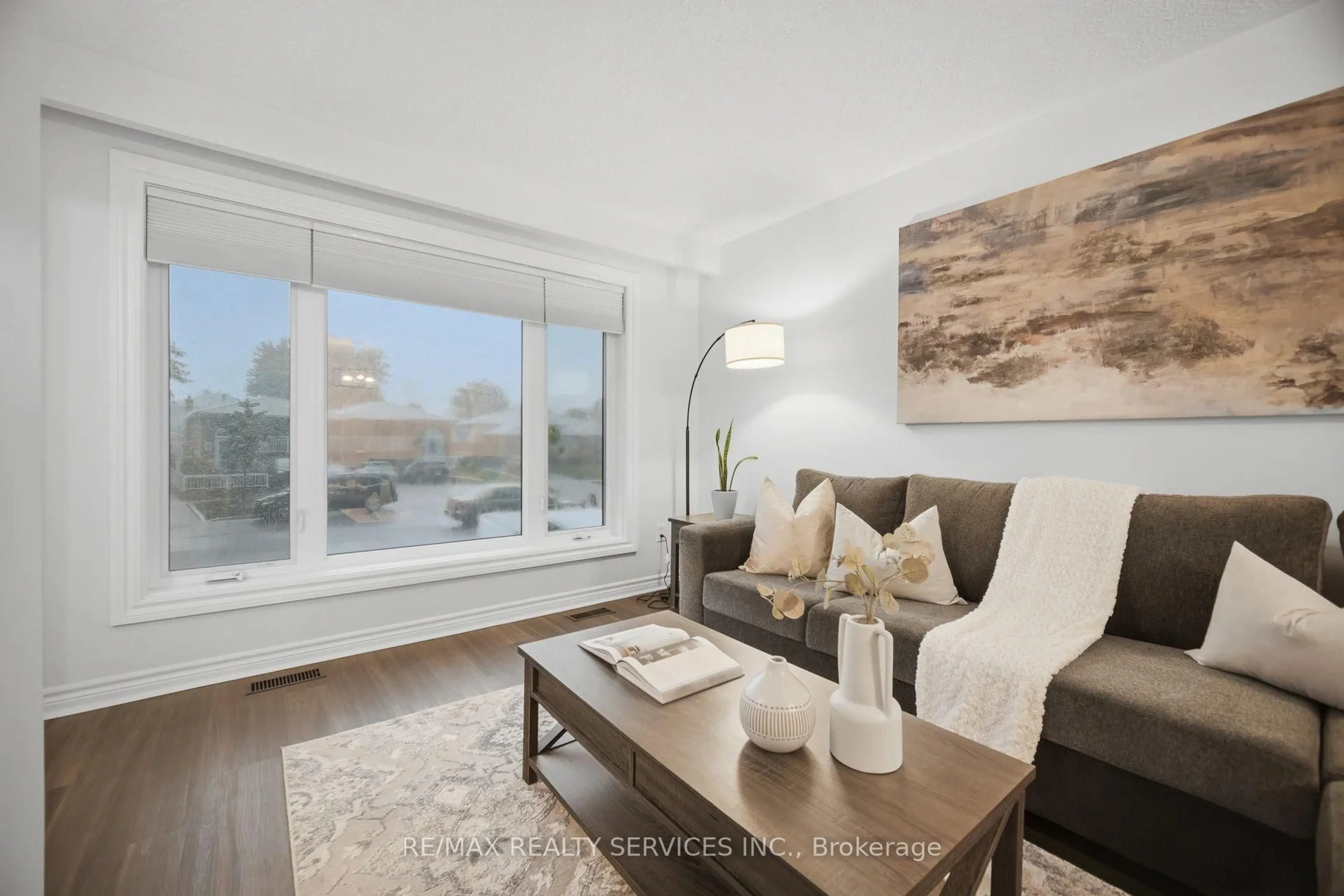 Living room with furniture, wood/laminate floor for 2414 Whaley Dr, Mississauga Ontario L5B 2B5