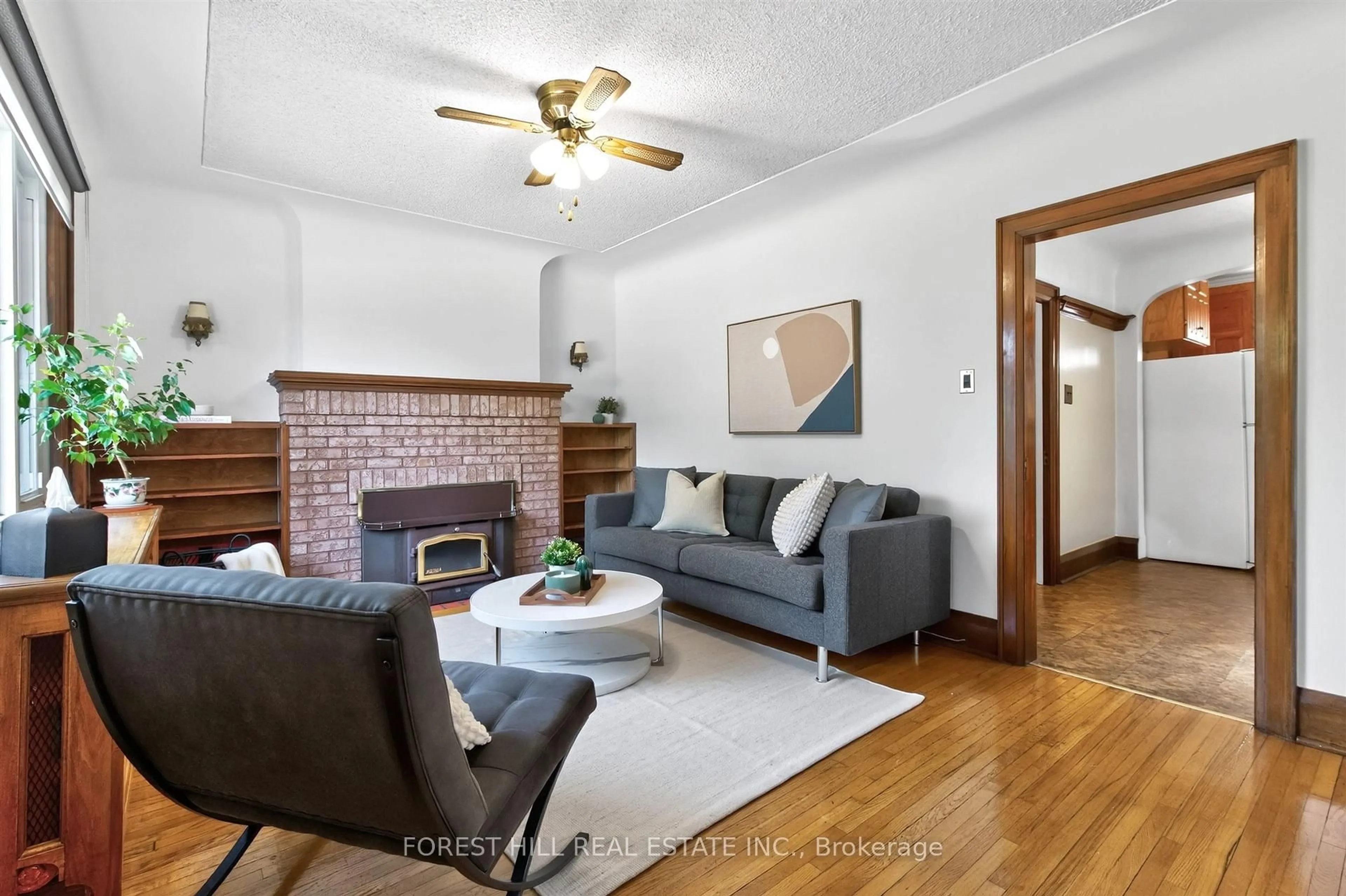 Living room with furniture, wood/laminate floor for 11 Yarrow Rd, Toronto Ontario M6M 4E2