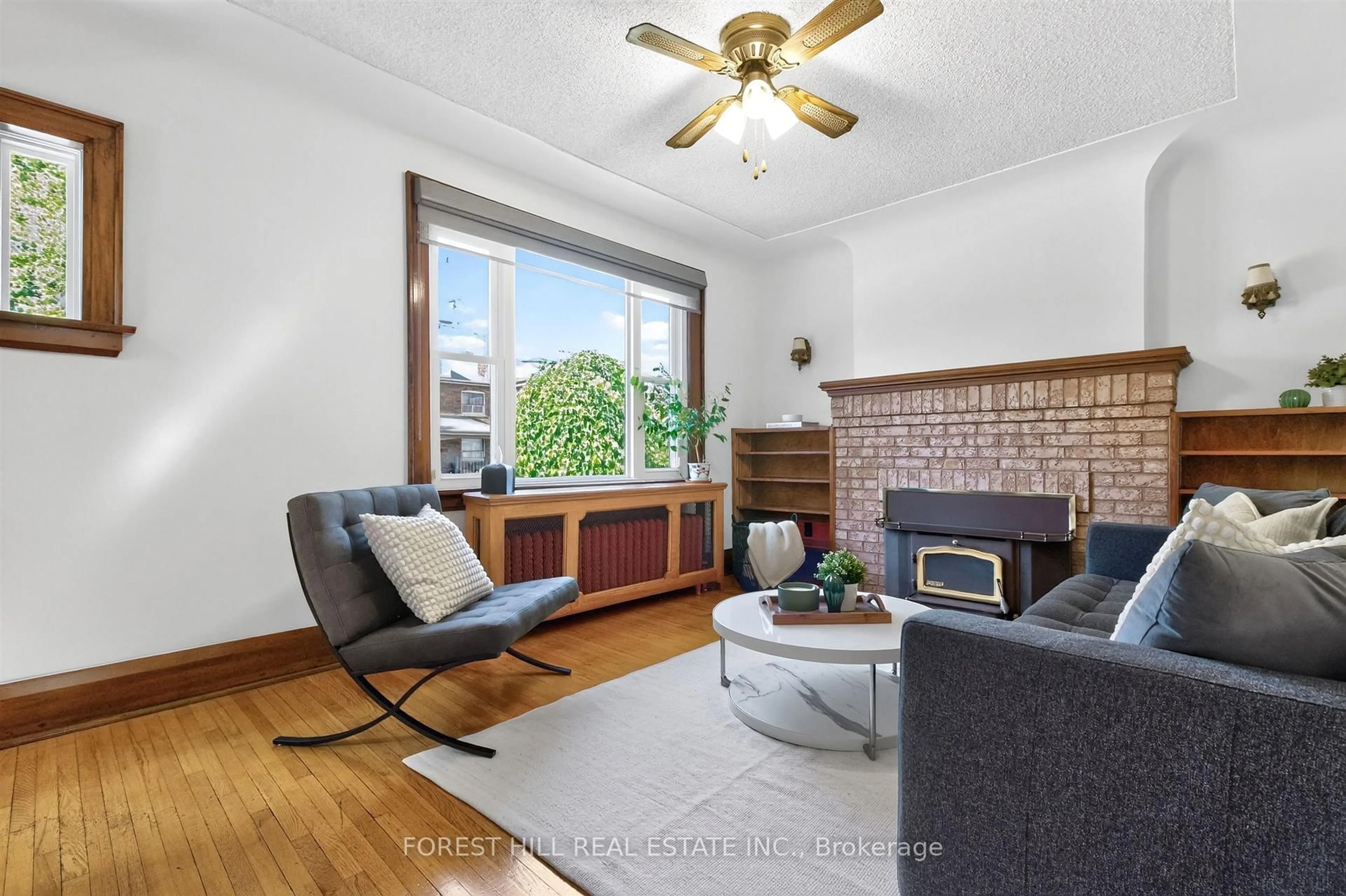 Living room with furniture, wood/laminate floor for 11 Yarrow Rd, Toronto Ontario M6M 4E2