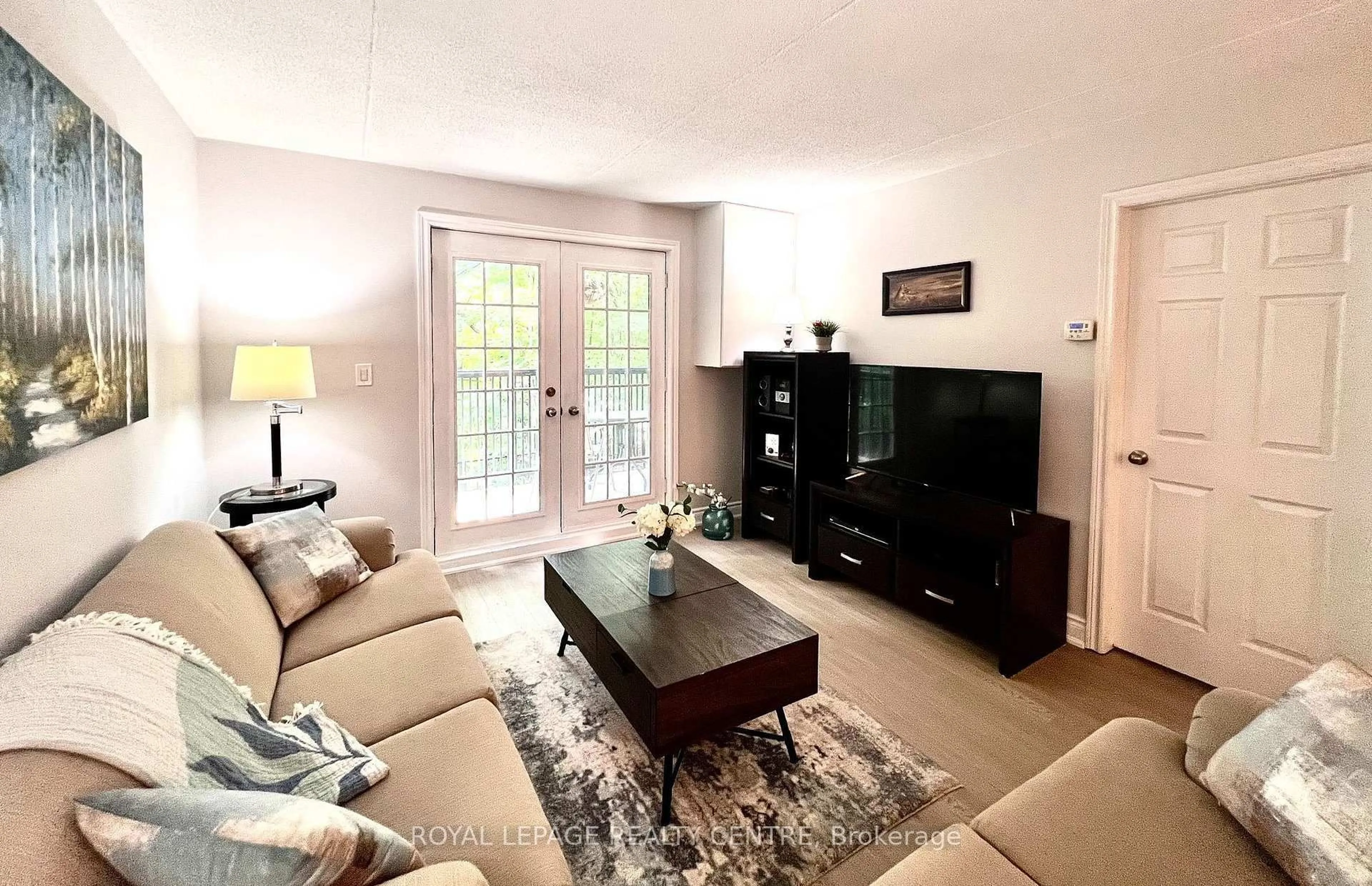 Living room with furniture, wood/laminate floor for 2040 Cleaver Ave #115, Burlington Ontario L7M 4C4