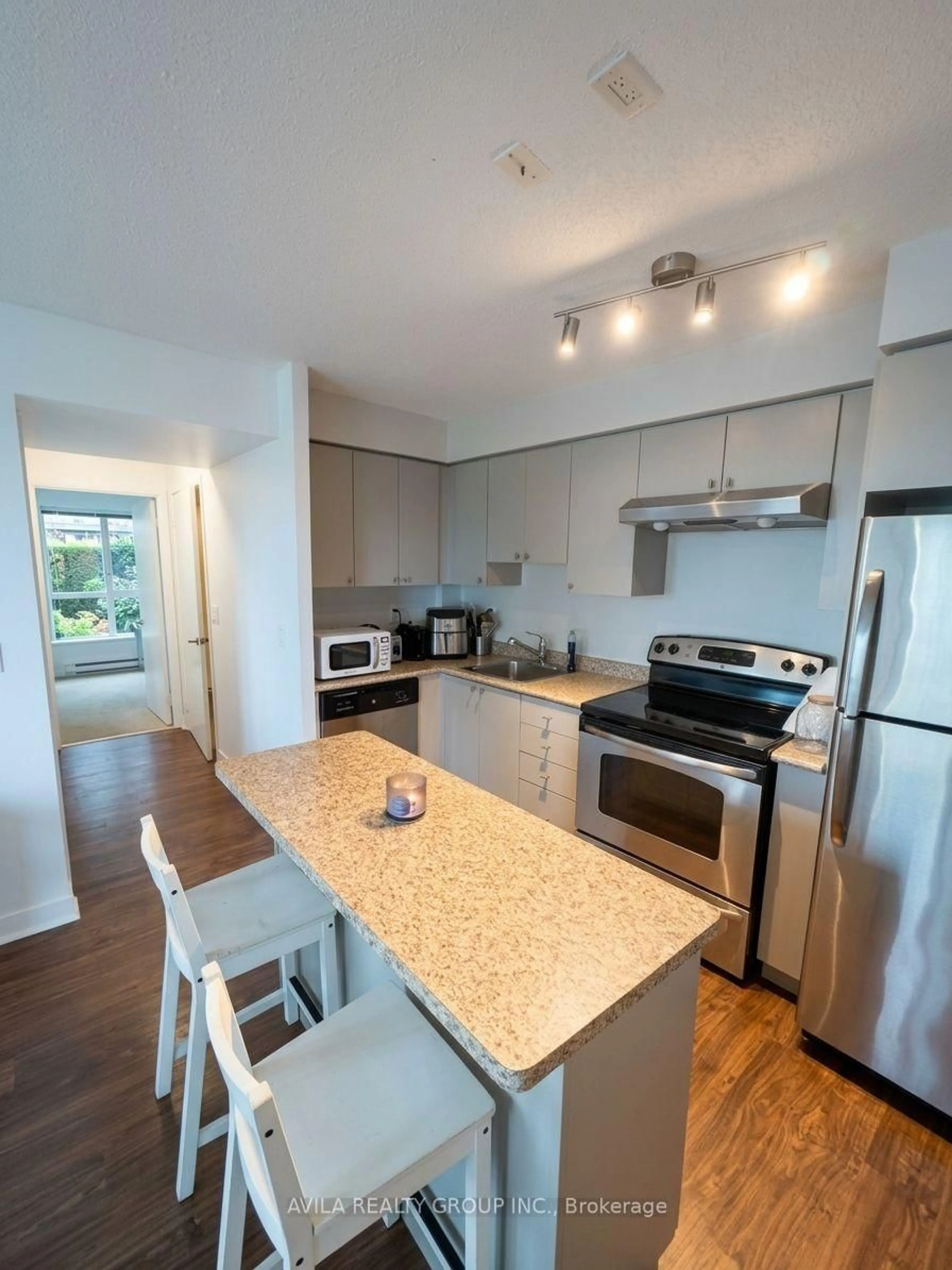 Open concept kitchen, wood/laminate floor for 155 Legion Rd #2108, Toronto Ontario M8Y 0A7