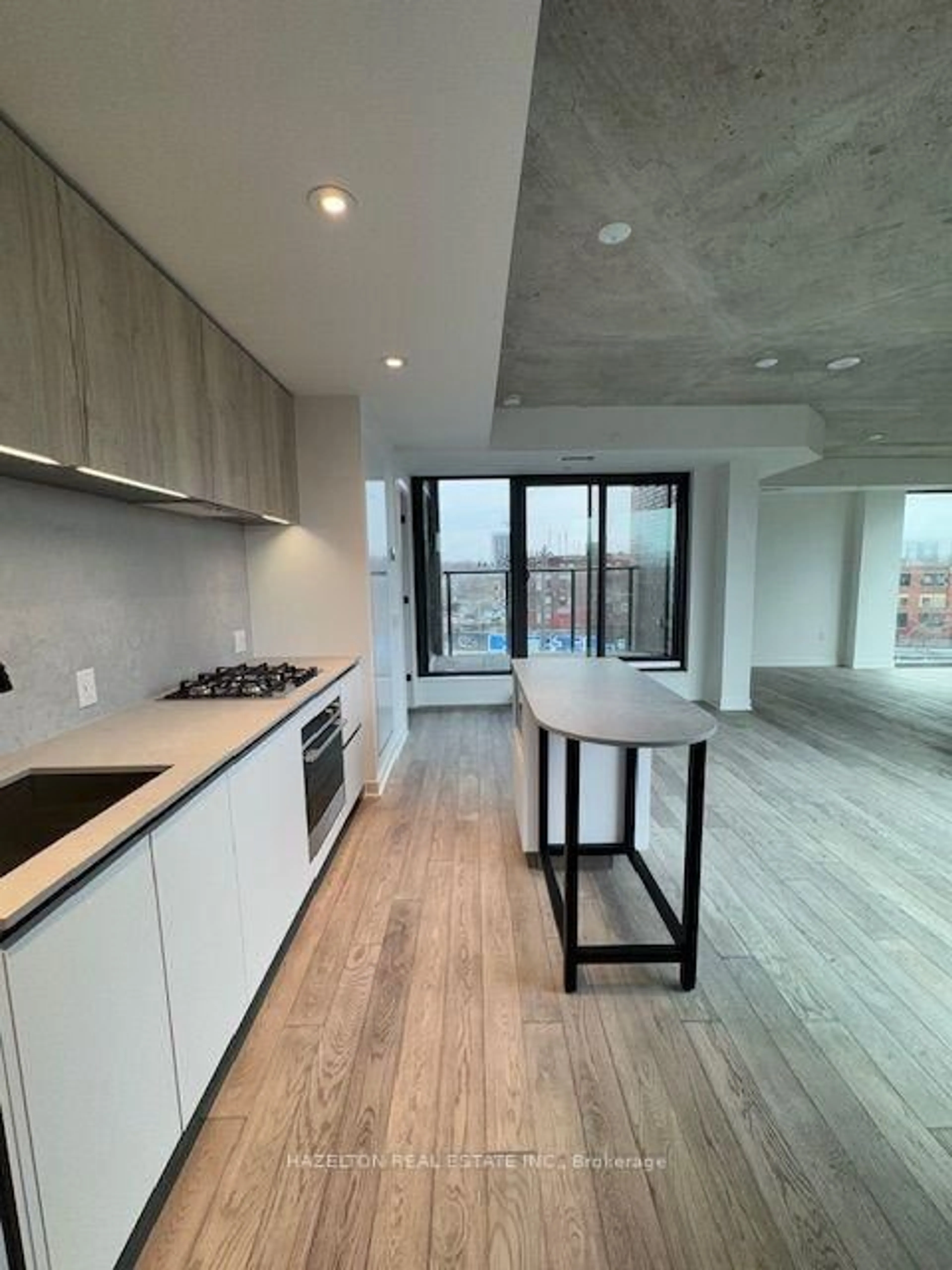 Open concept kitchen, cement floor for 2625 Dundas St #514, Toronto Ontario M6P 0C5