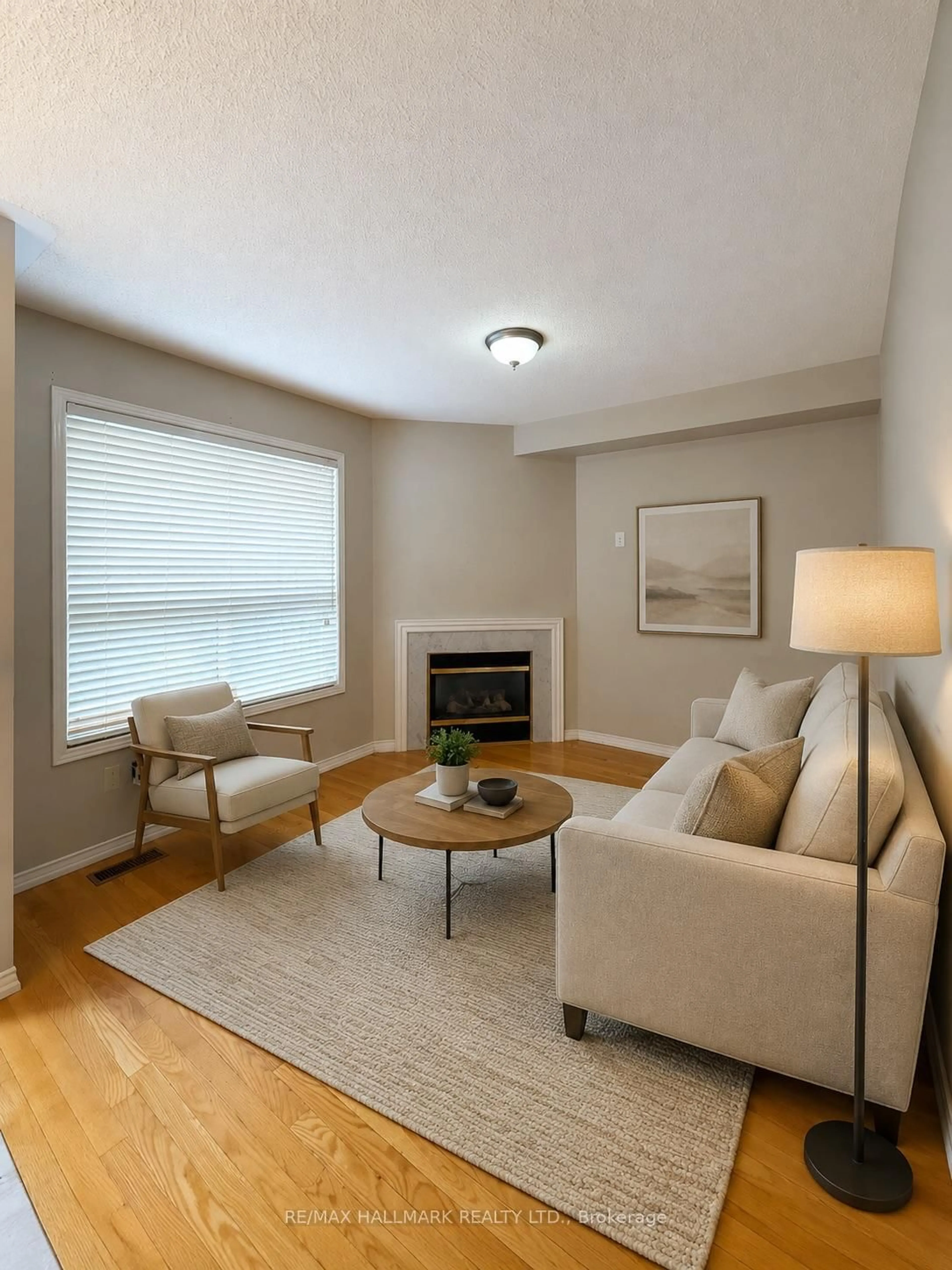 Living room with furniture, wood/laminate floor for 50 Farthingale Cres, Brampton Ontario L7A 1W7
