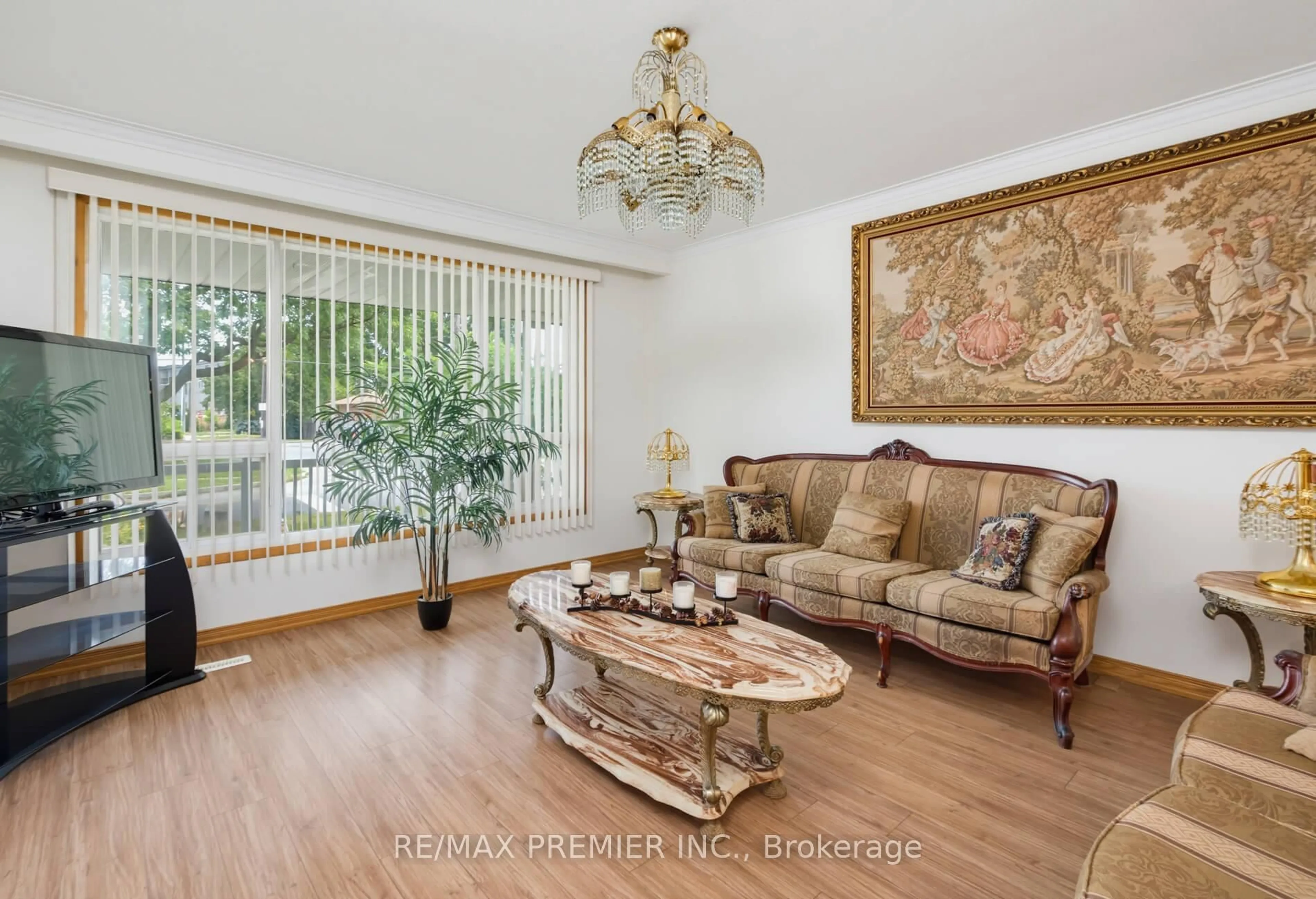 Living room with furniture, wood/laminate floor for 27 Whitfield Ave, Toronto Ontario M9L 1G2
