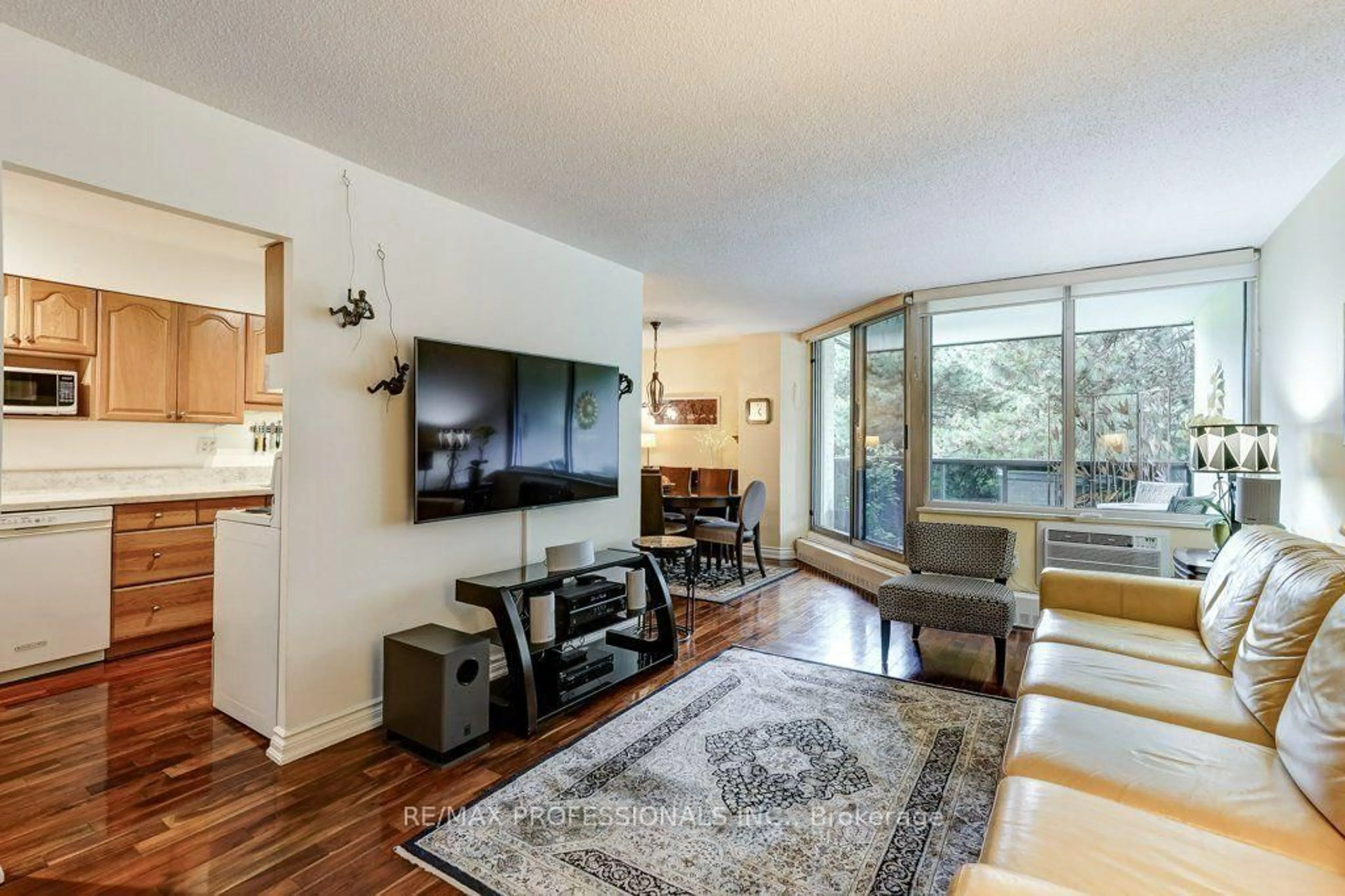 Living room with furniture, unknown for 420 Mill Rd #112, Toronto Ontario M9C 1Z1