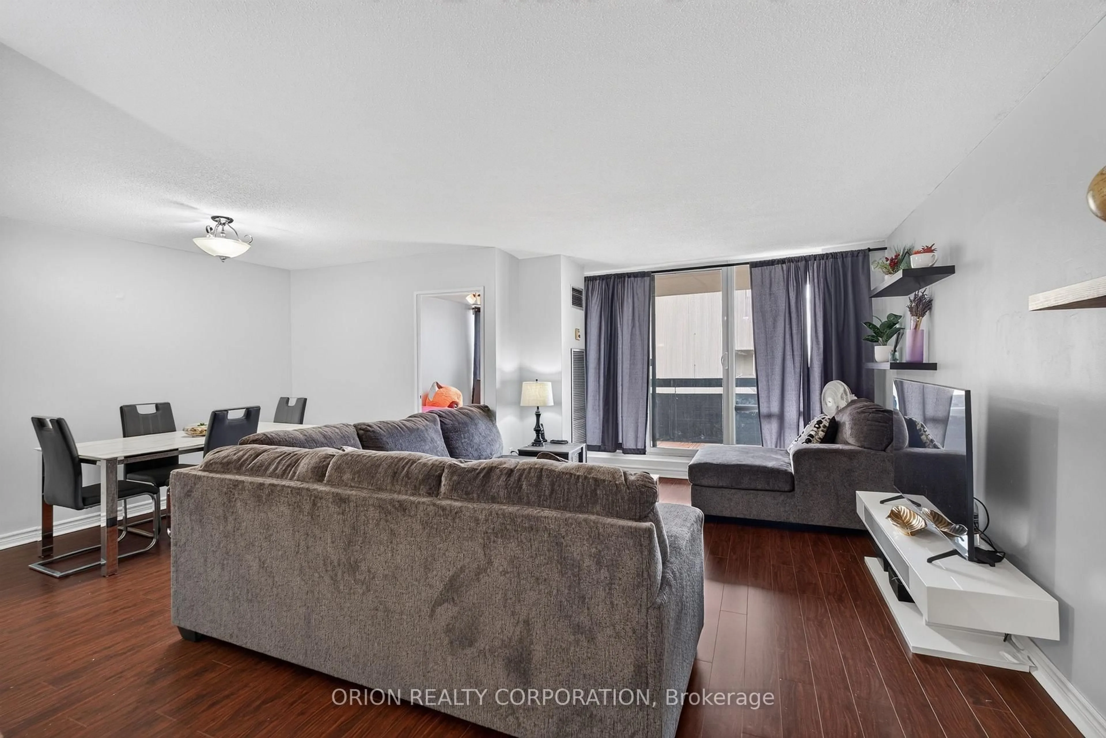 Living room with furniture, wood/laminate floor for 362 The East Mall #309, Toronto Ontario M9B 6C4