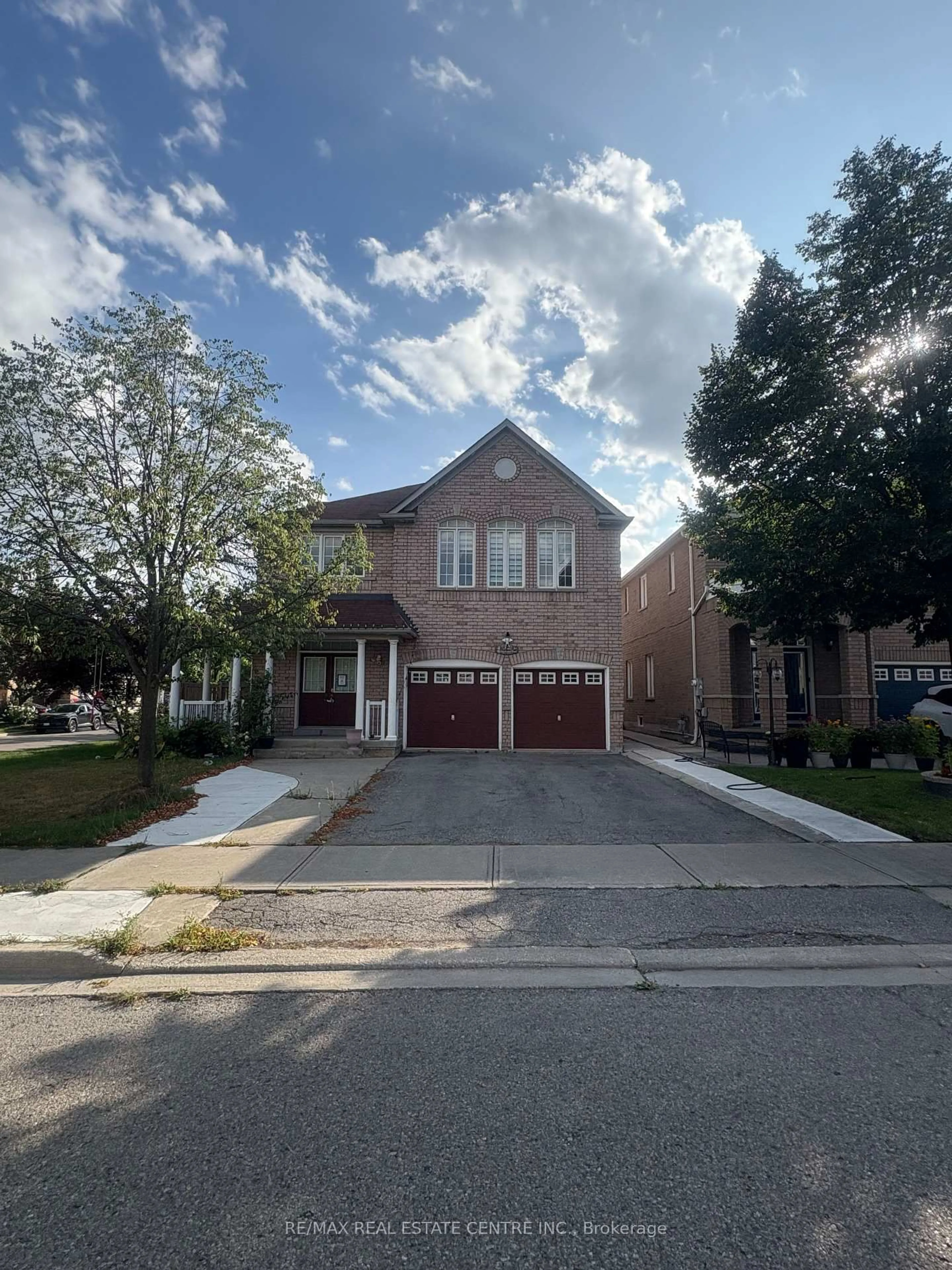 Home with brick exterior material, street for 32 Midnightsun Tr, Brampton Ontario L6R 3K3